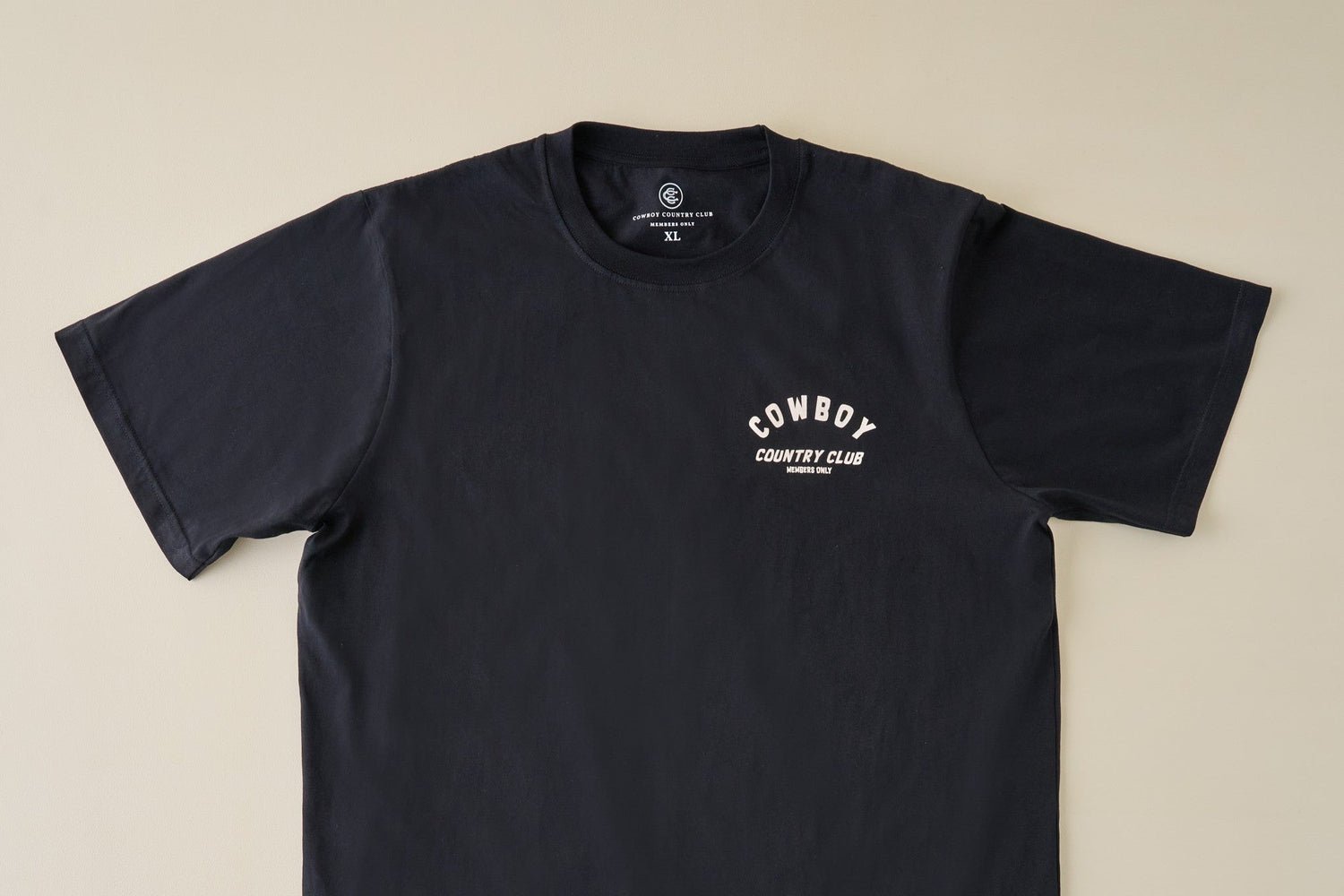 Shop Clothing and hats for men. Image features and black short sleeve tee.