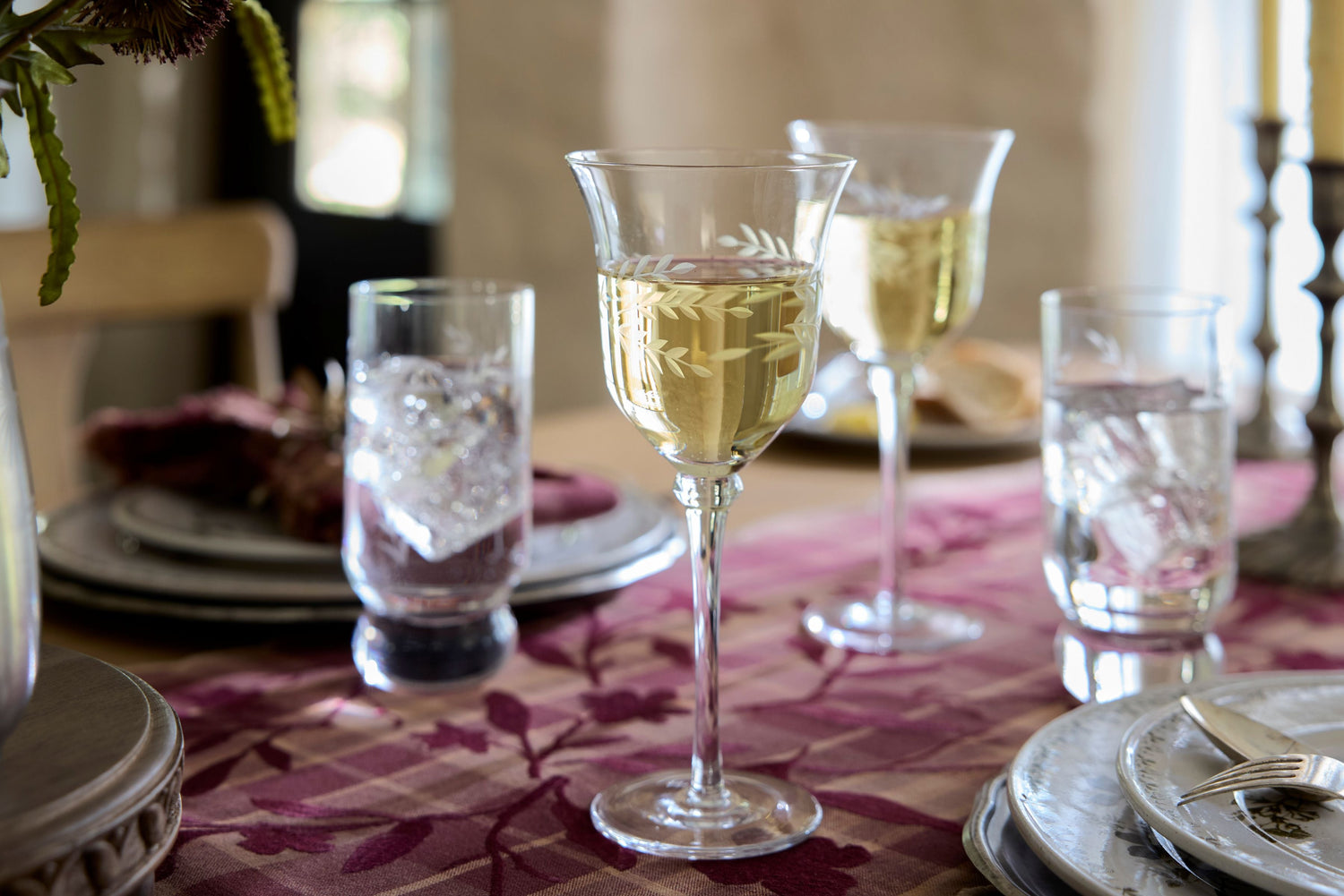 Shop drinkware and pitchers. Image features wine glasses and drinking glasses set on table.