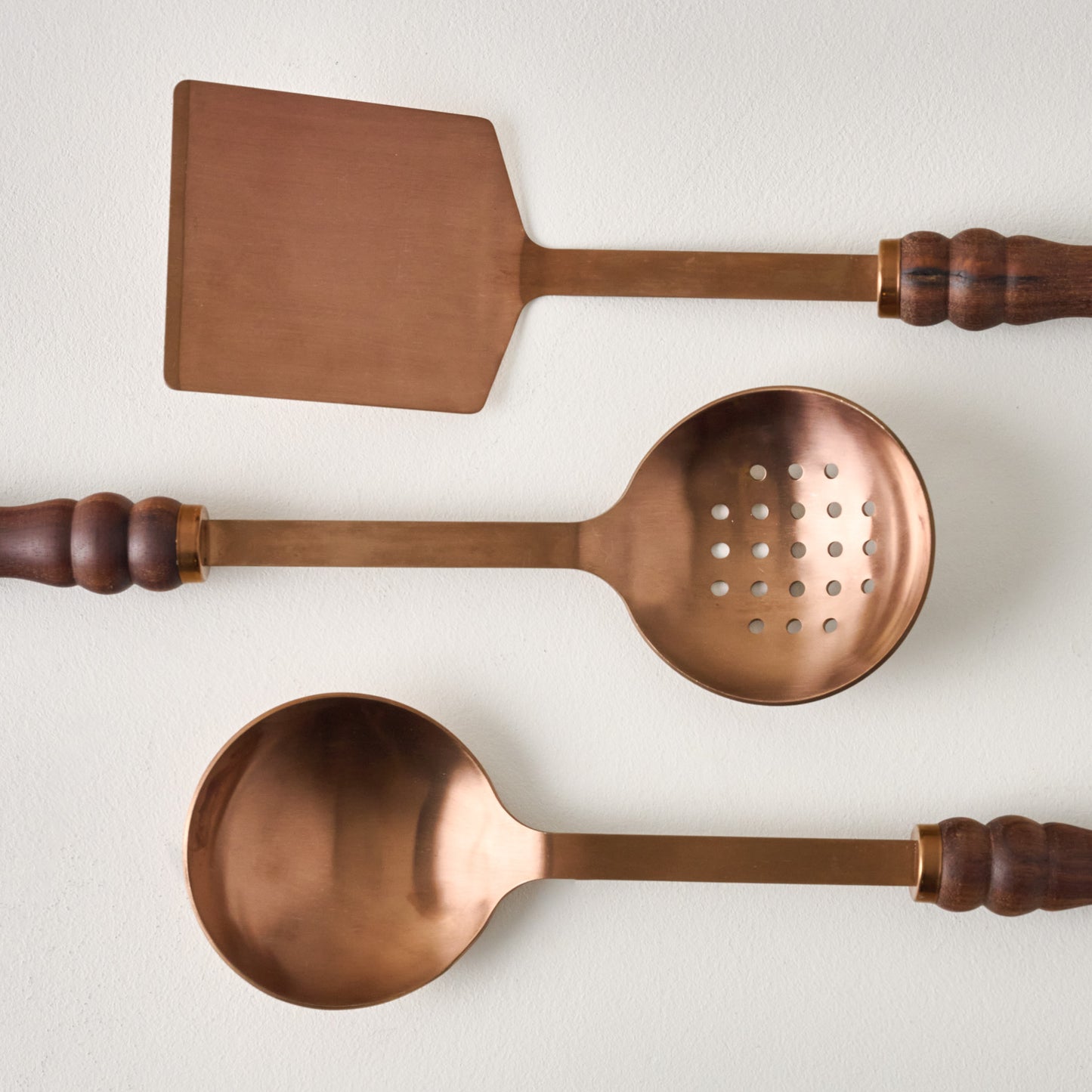Walnut Handle Copper Turner shown with slotted spoon and spoon