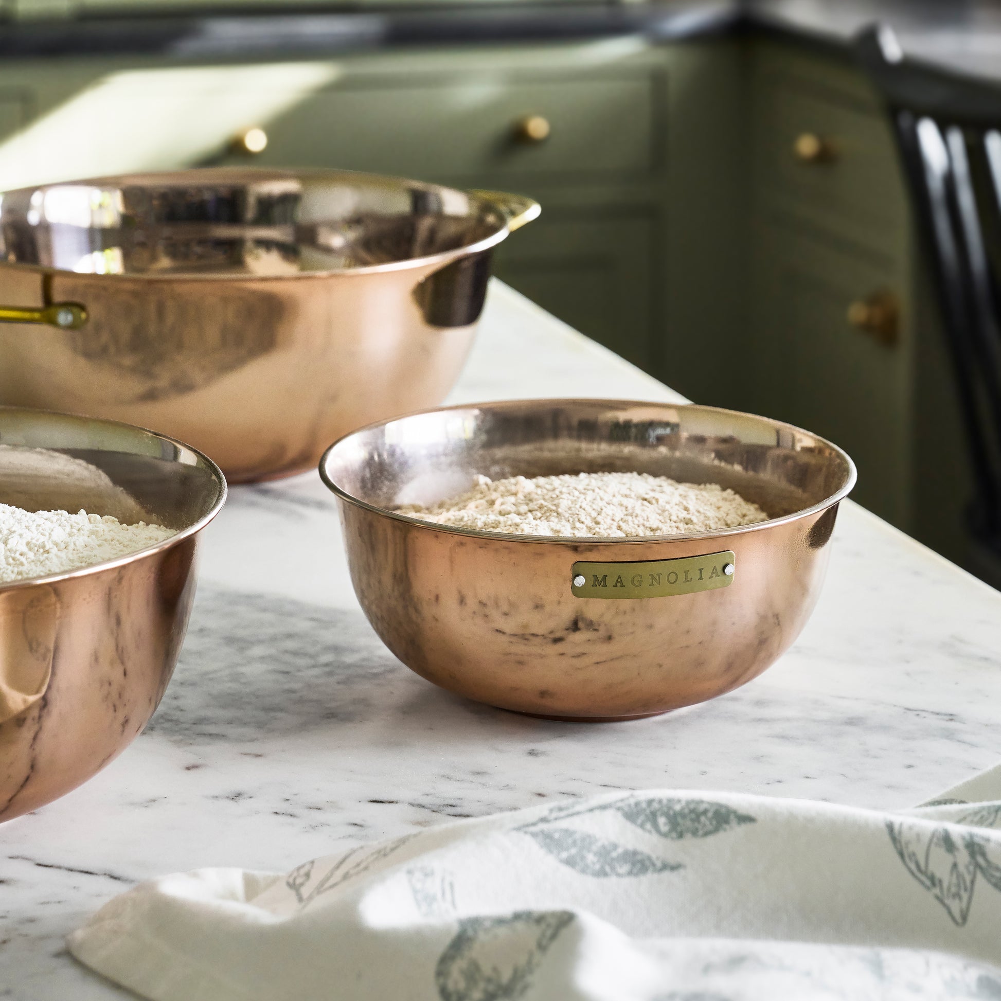 Magnolia Copper Mixing Bowl Set of Three in a room