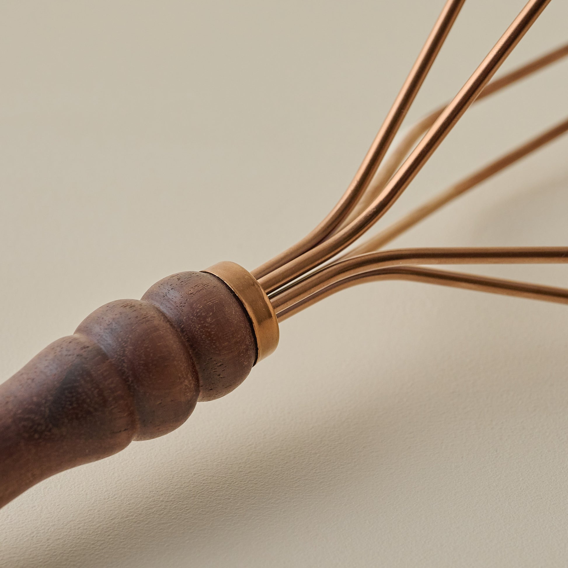 Walnut Handle Copper Potato Masher up close