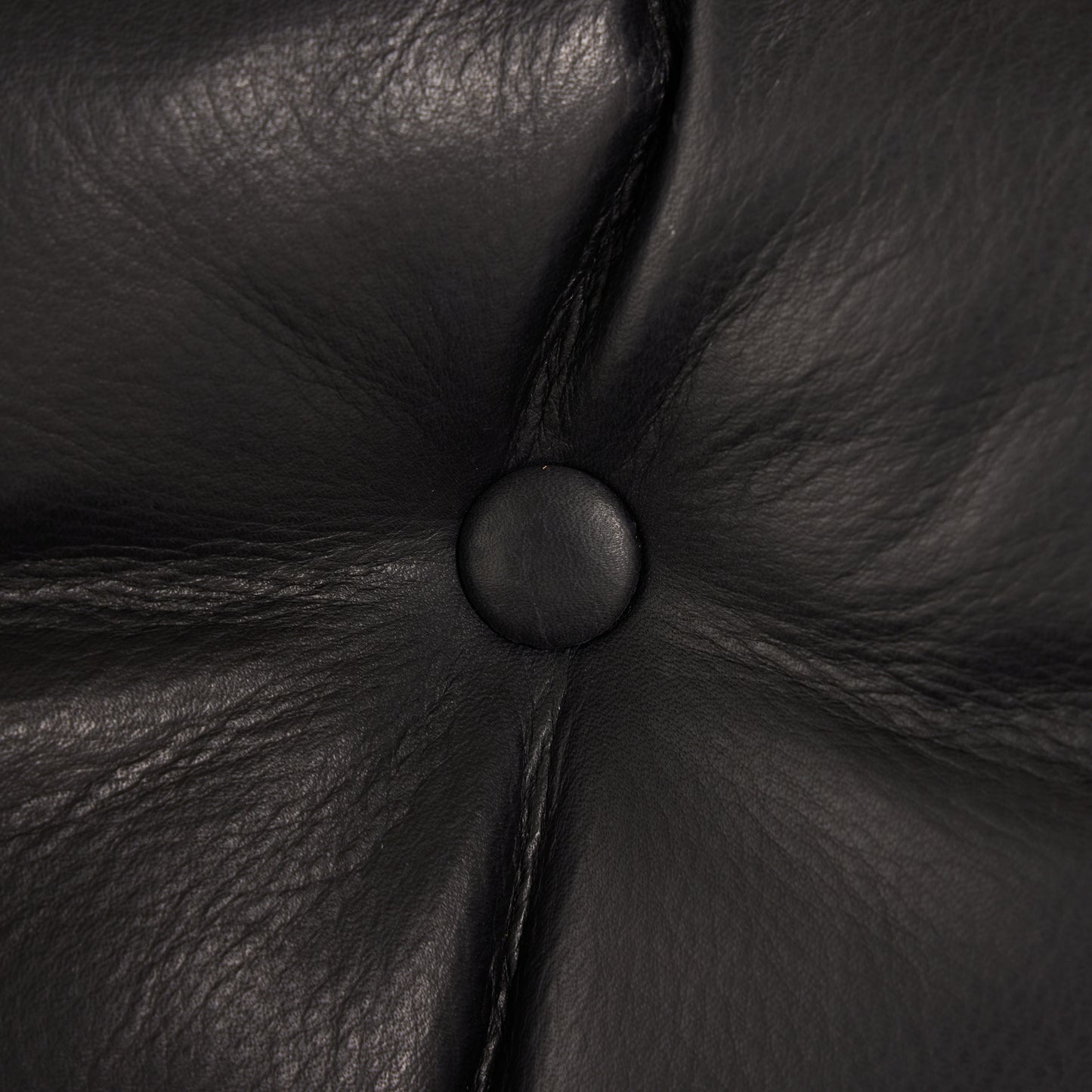 Flynn Chair heirloom black leather close up of button on chair