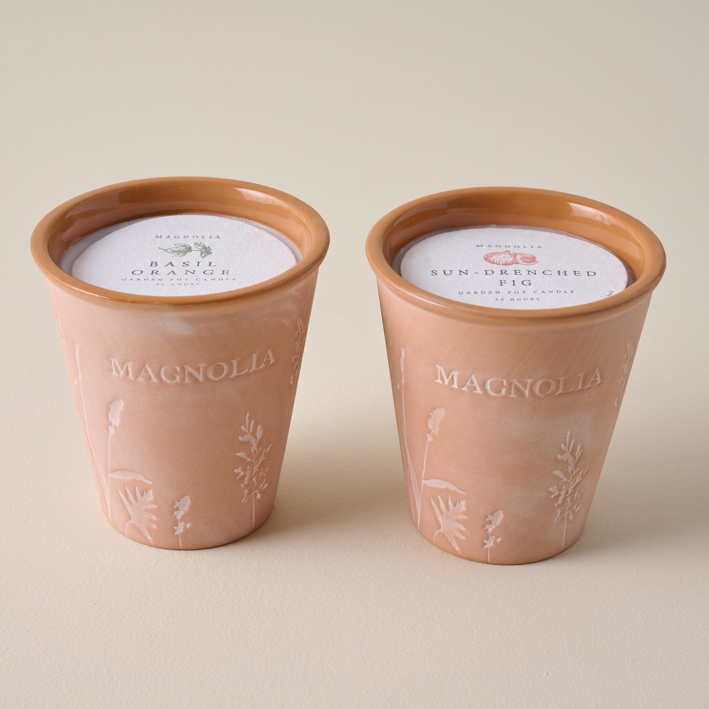 Magnolia Basil Orange Garden Pot Candle shown with Sun Drenched Fig Candle