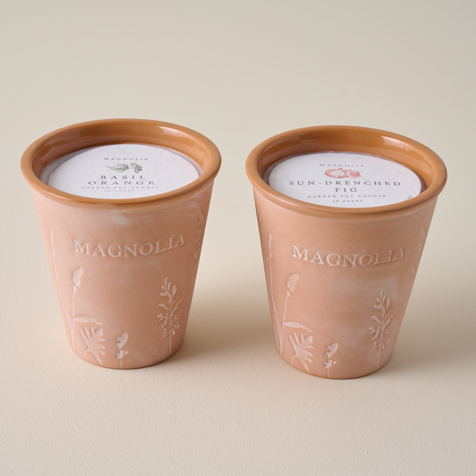 Magnolia Basil Orange Garden Pot Candle shown with Sun Drenched Fig Candle