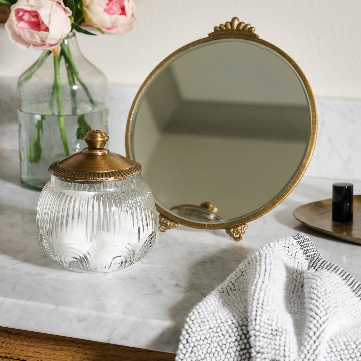 Etched Glass and Brass Canister on bathroom counter
