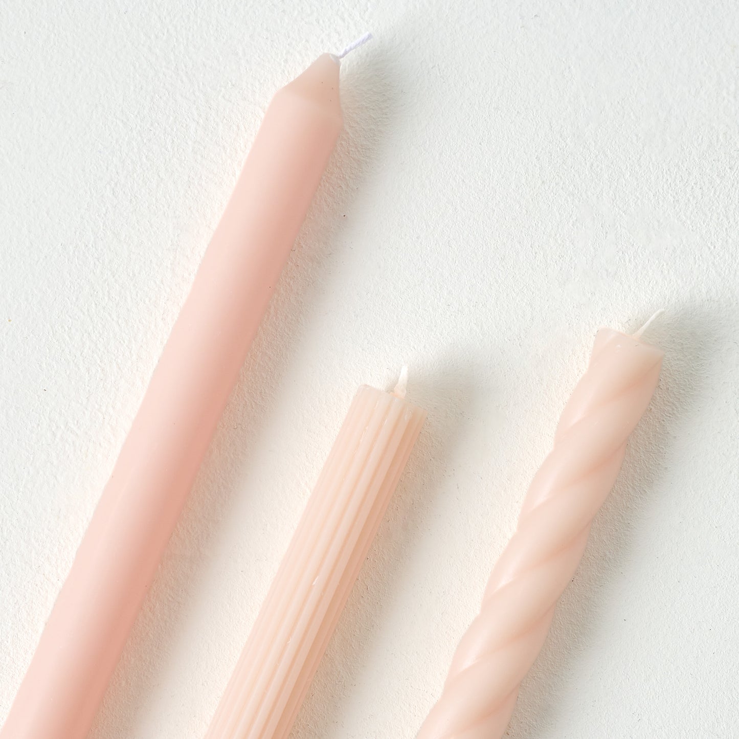 Assorted Blush Taper Candle Set up close