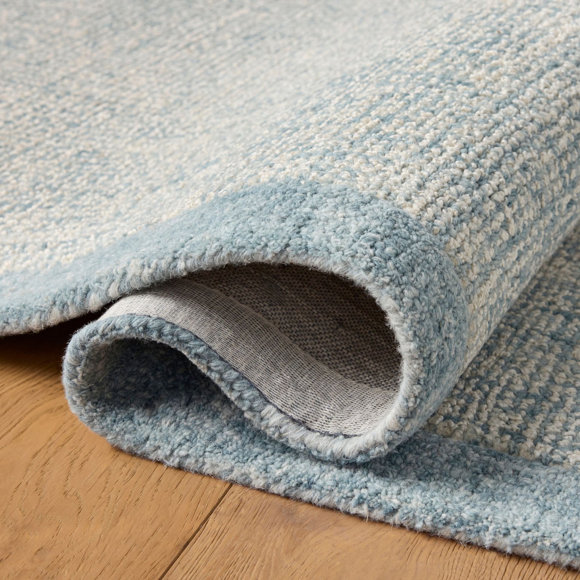 Henley Ivory Blue Rug shown folded