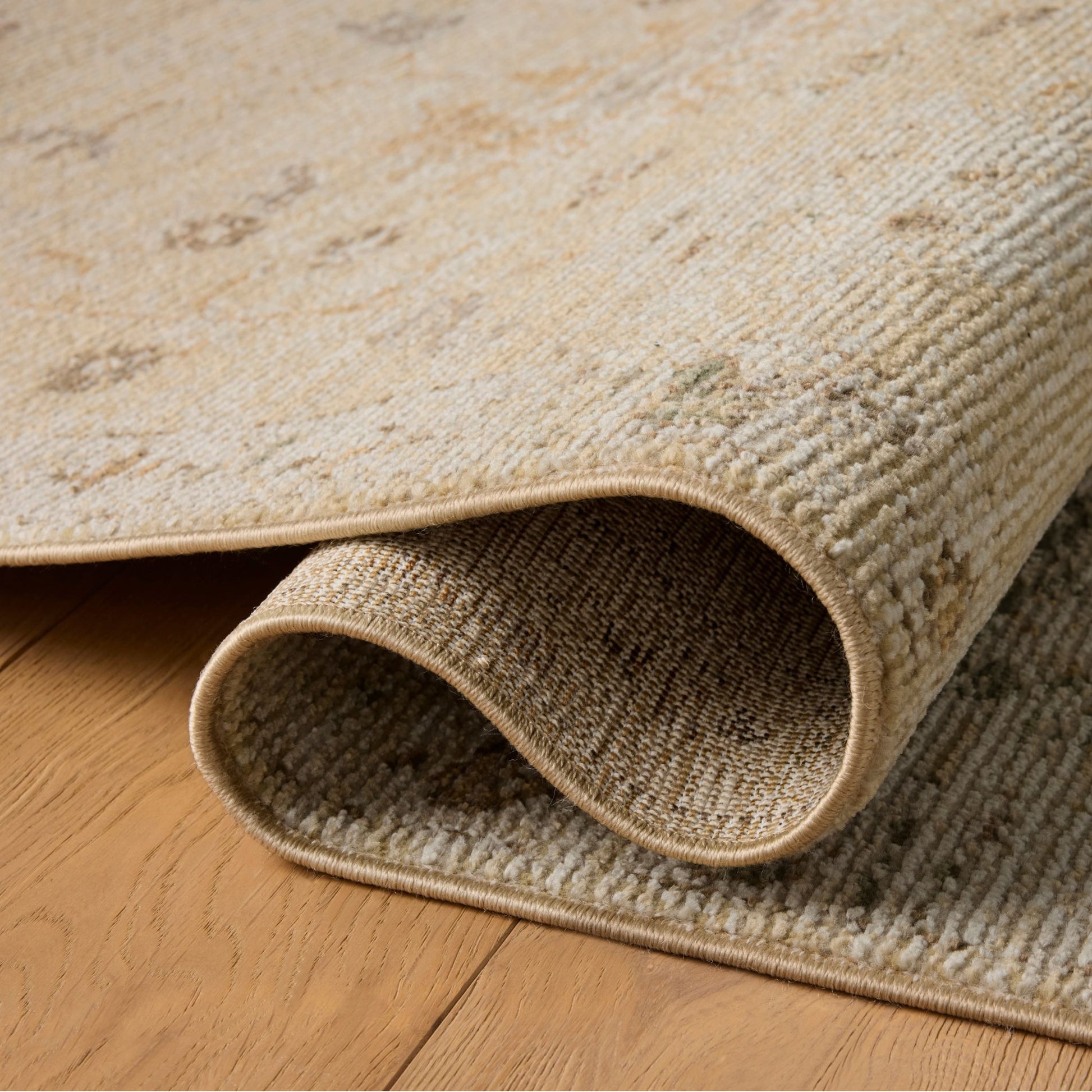 Pace Apricot Multi Rug shown rolled/folded