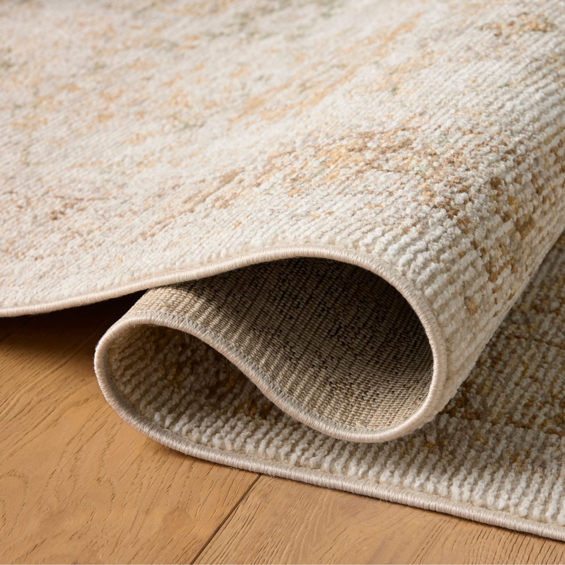 Pace Natural Multi Rug shown rolled/folded