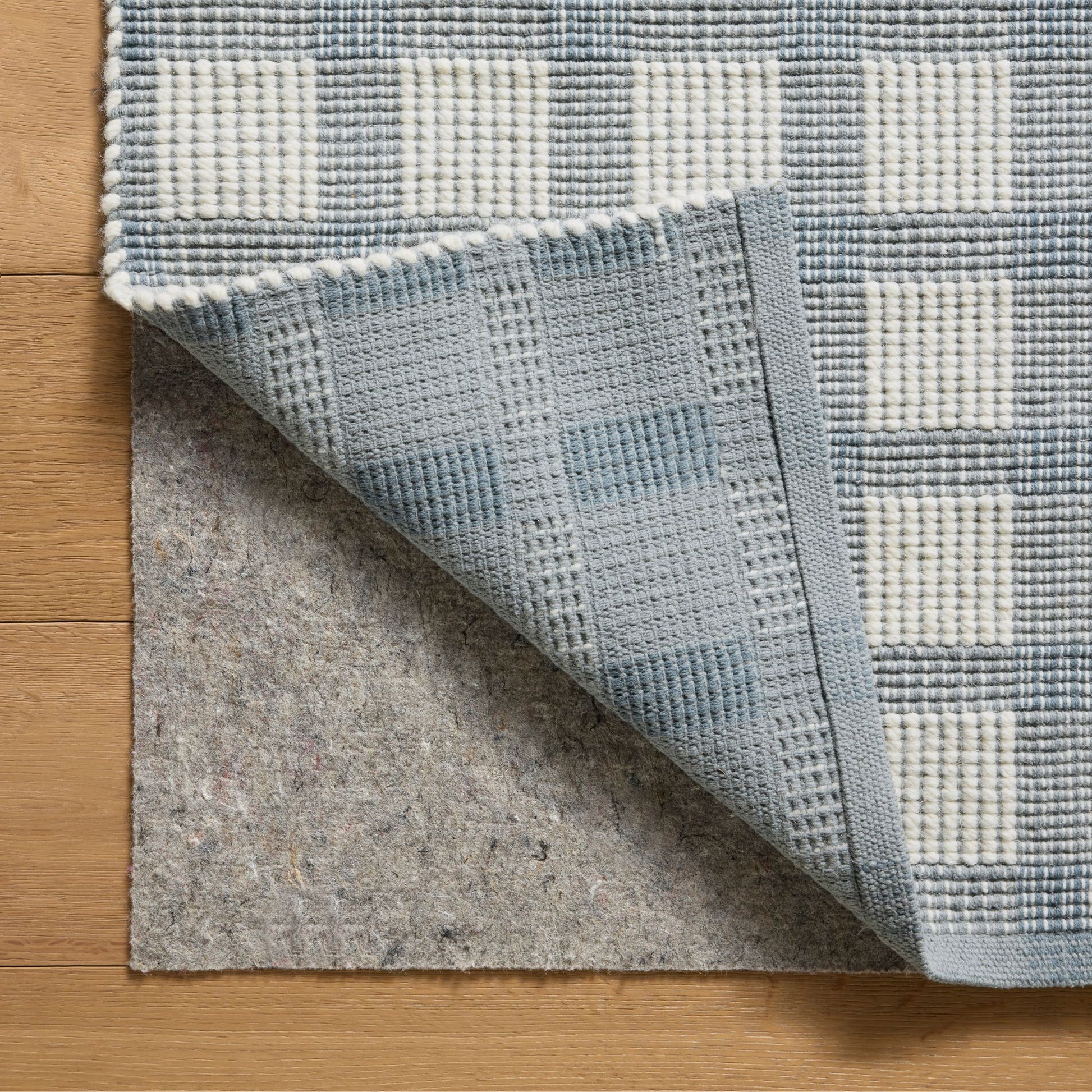 Ryder Blue Ivory Rug corner shown flipped