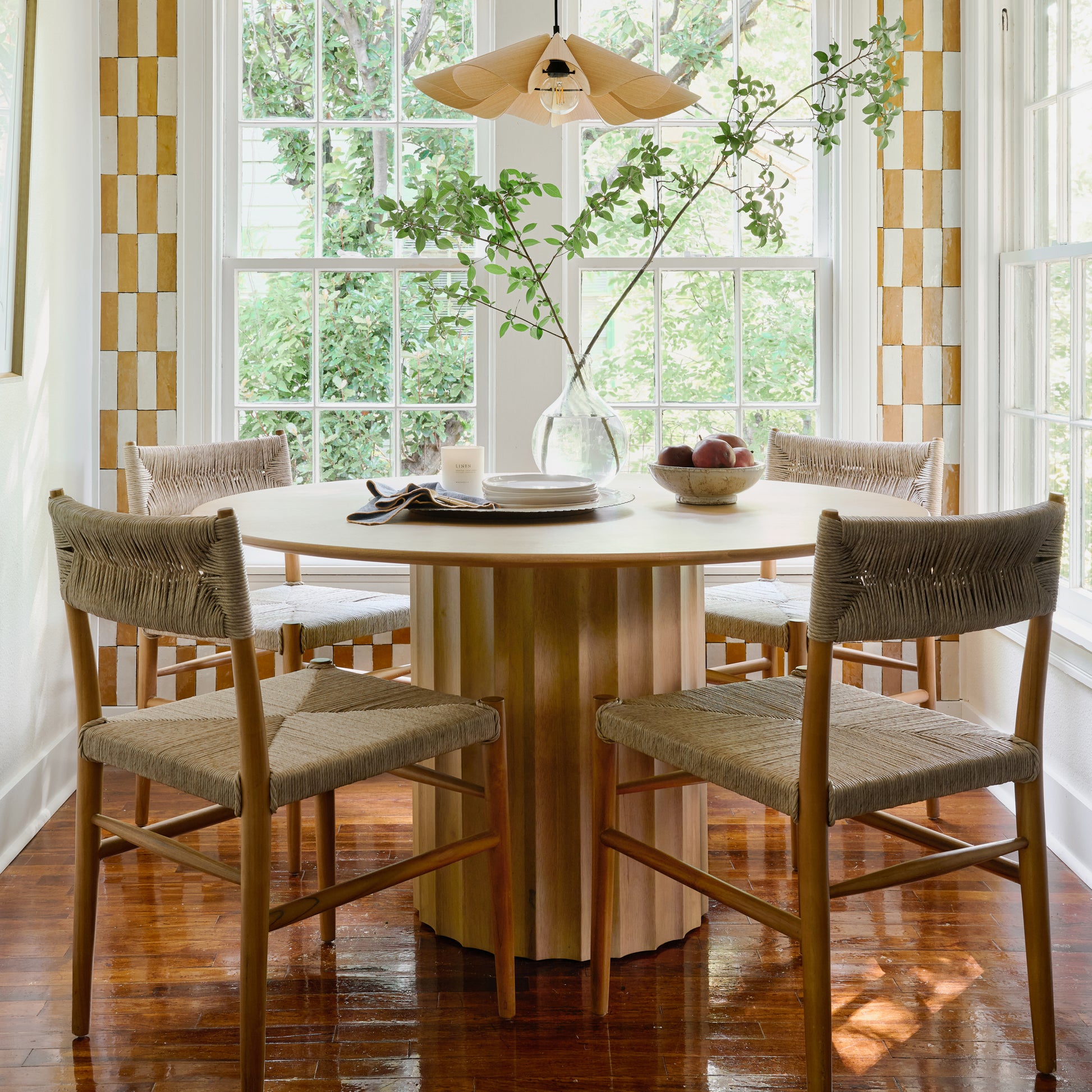 Rustic Cream Accent Bowl filled with fruit on a dining table