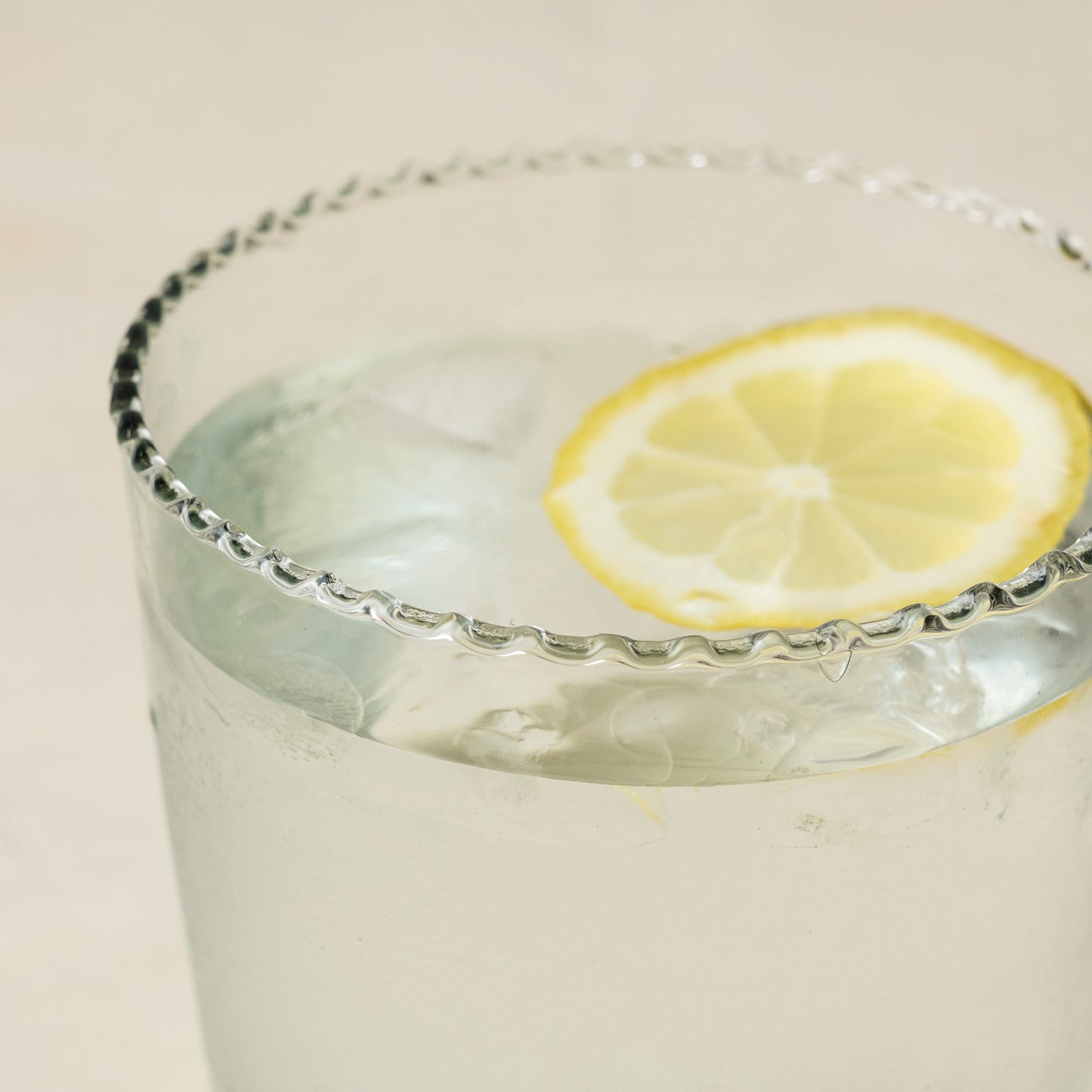 Elizabeth Bottle Cut Glass Tumbler close up with lemon in cup