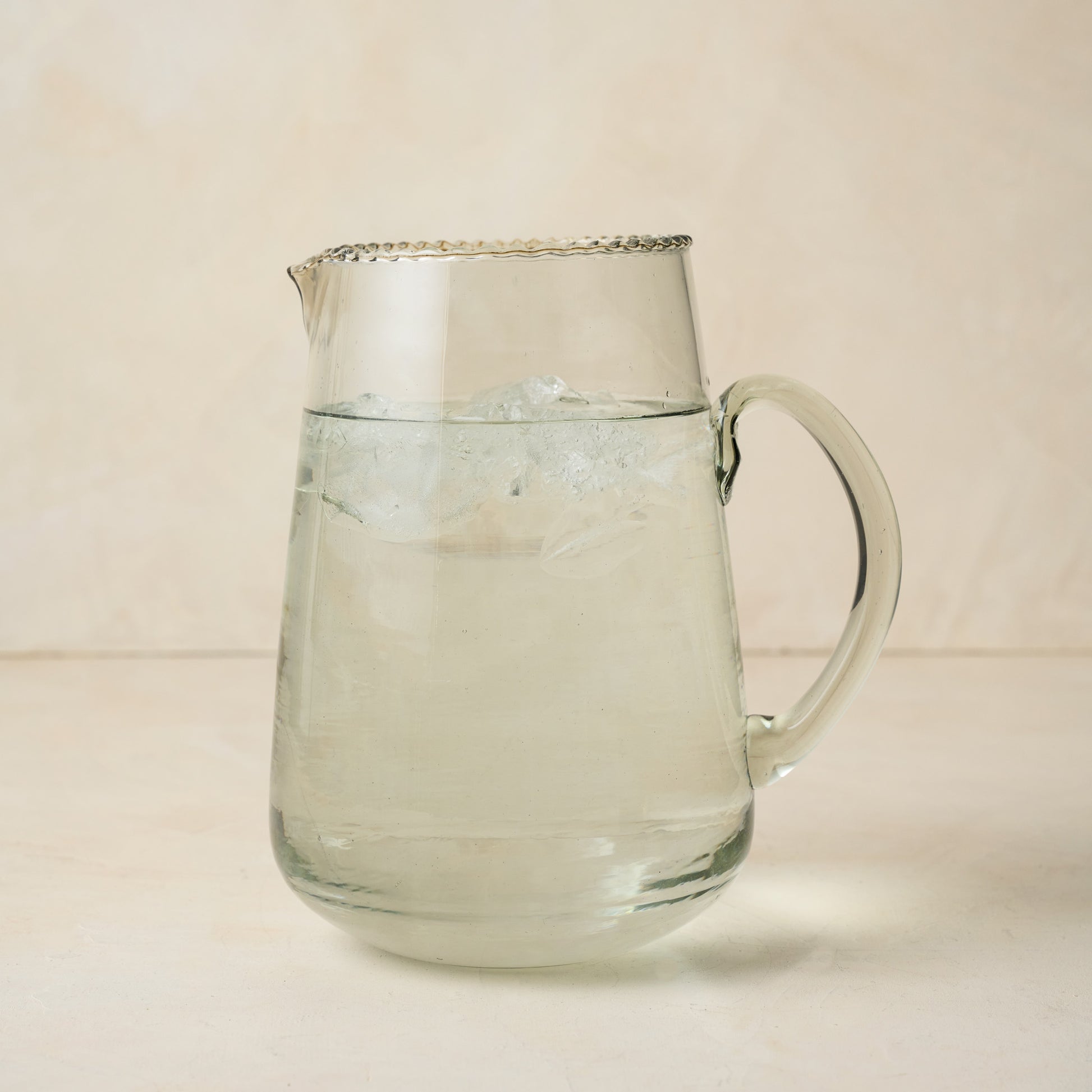 Elizabeth Bottle Cut Pitcher filled with ice water