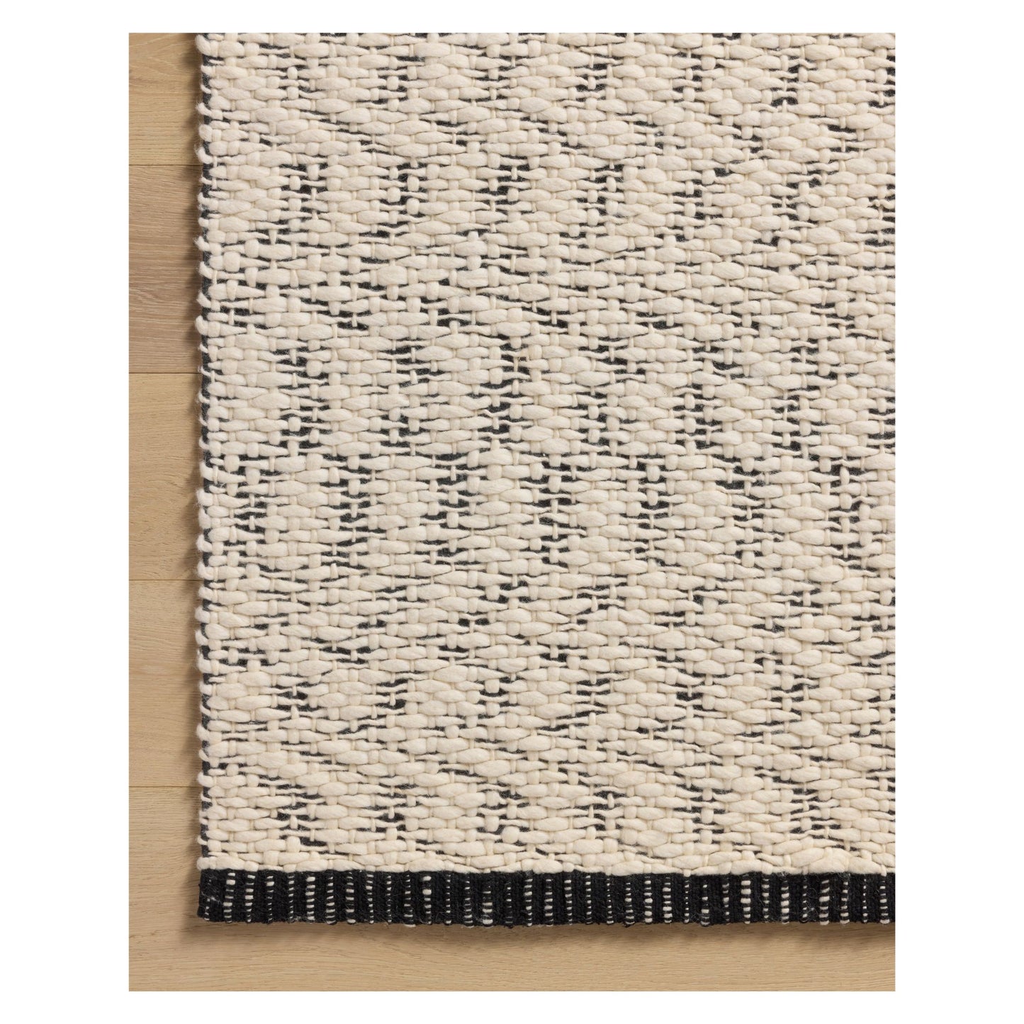 Betty Ivory Black Rug corner