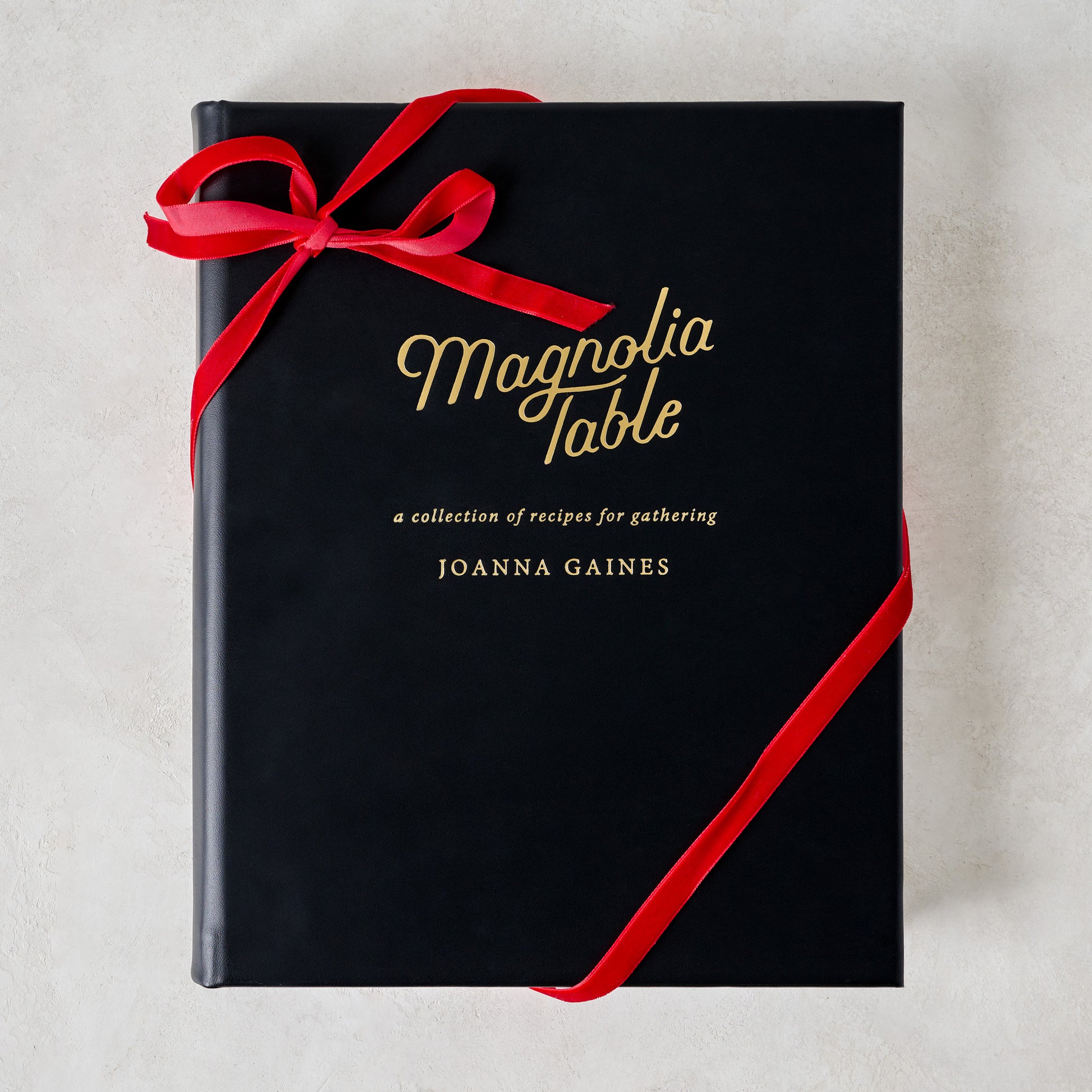 Leather Bound Magnolia Table Cookbook with ribbon around