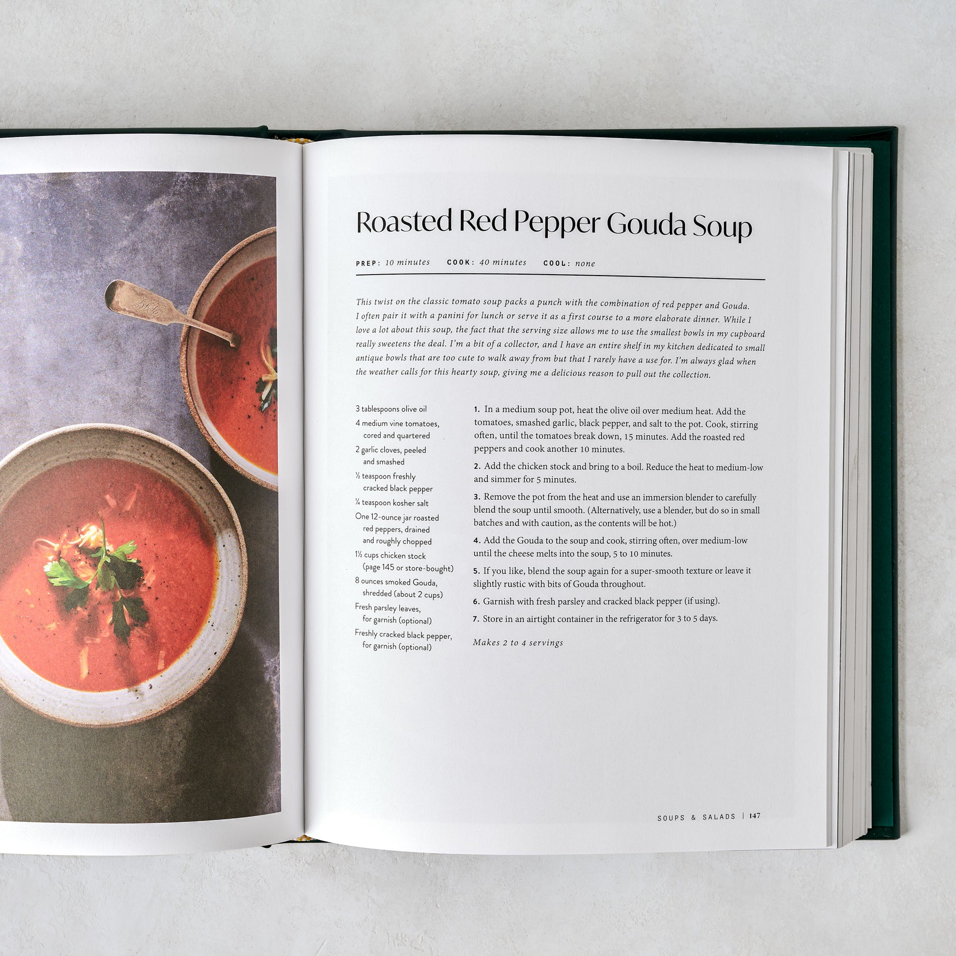 Leather Bound Magnolia Table Cookbook Volume 3 shown open to a recipe