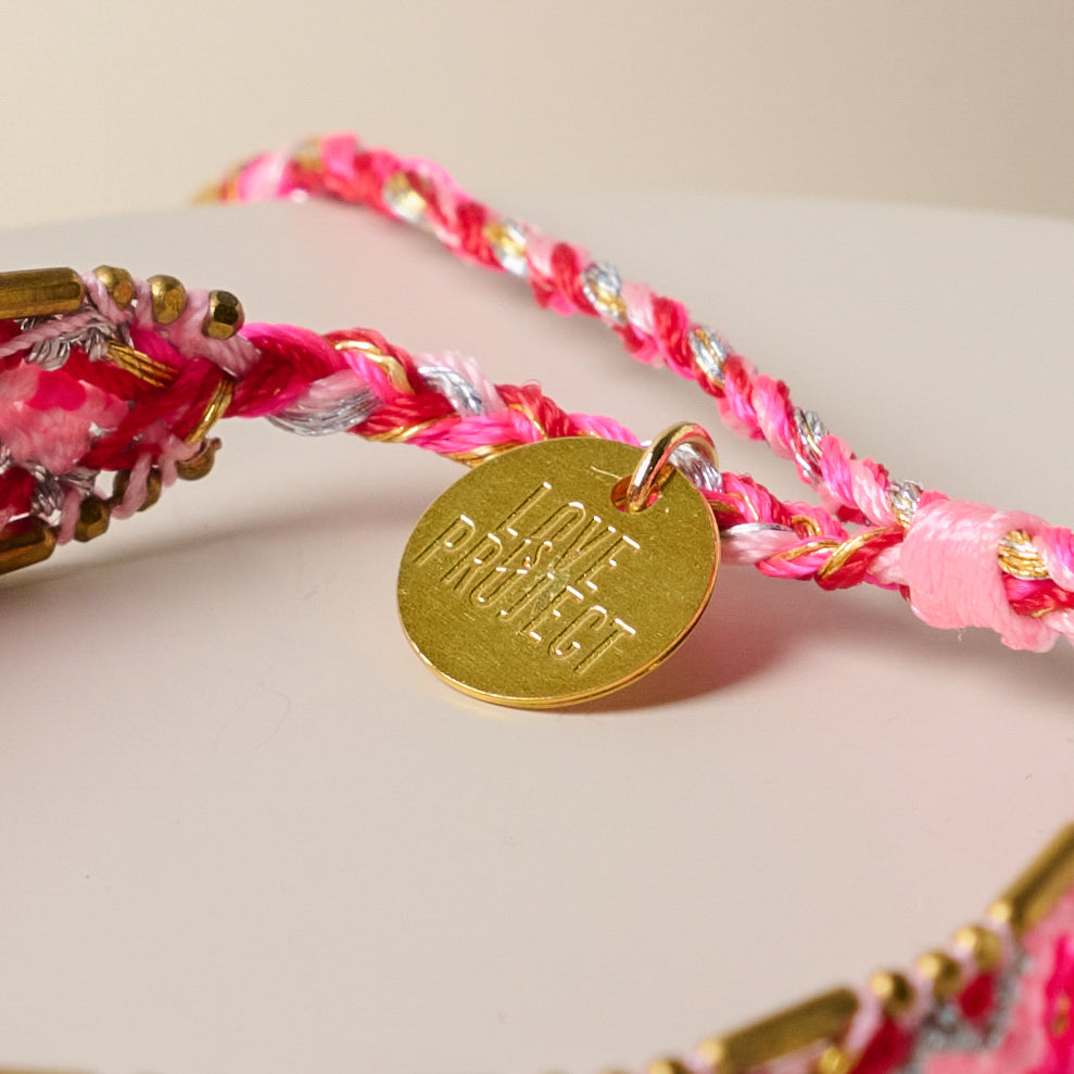 Bali Beaded Bracelet close up of charm that reads love project