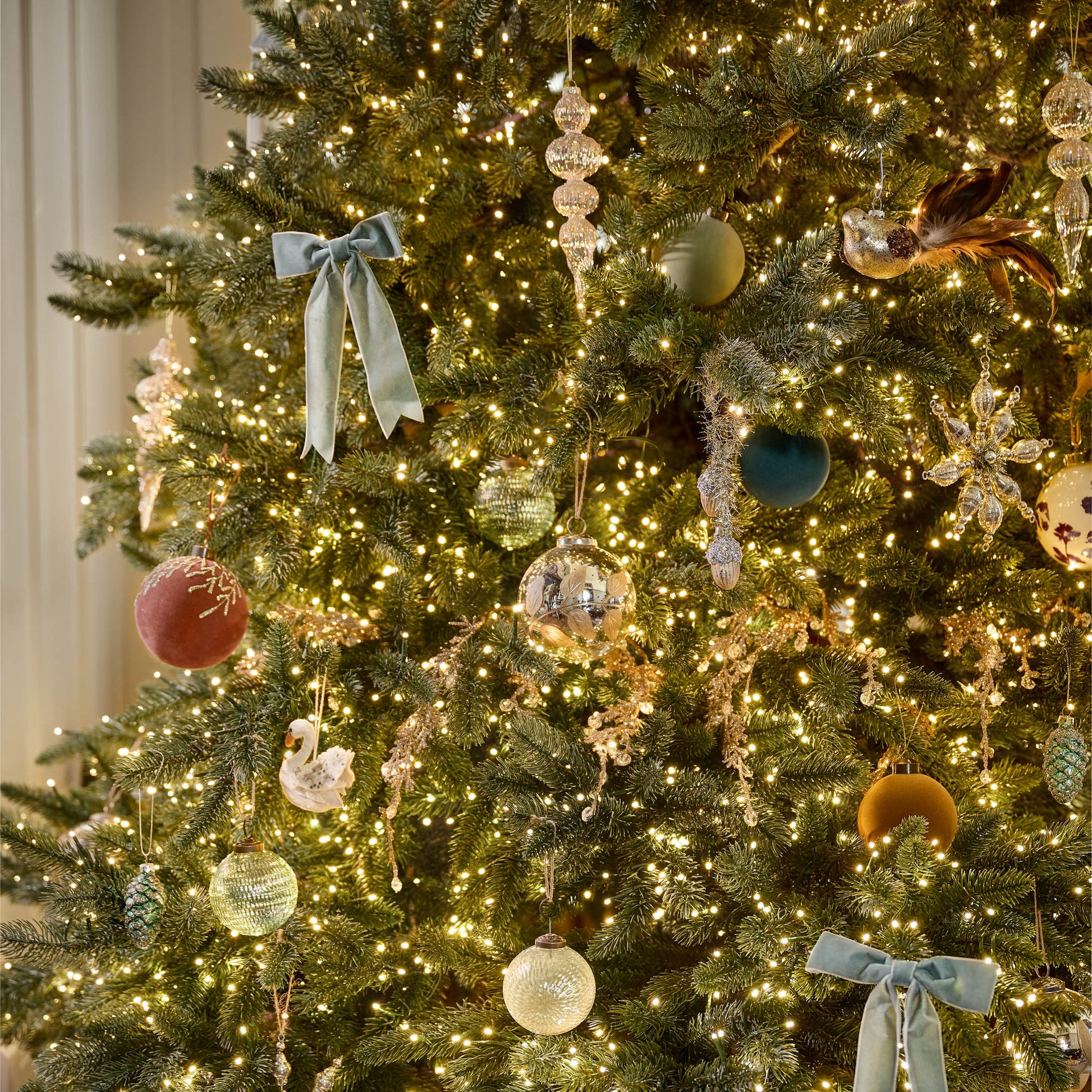 Mercury Glass and Gold Botanical Ornament on a tree
