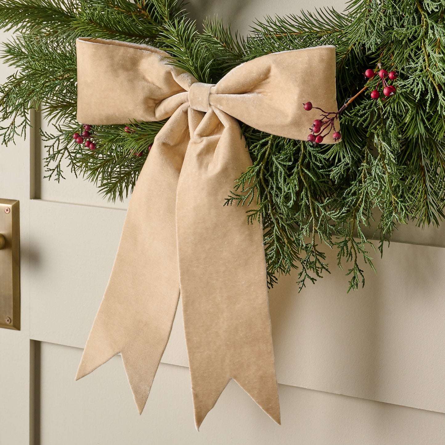 Cream Bountiful Bow Tree Topper shown on wreath