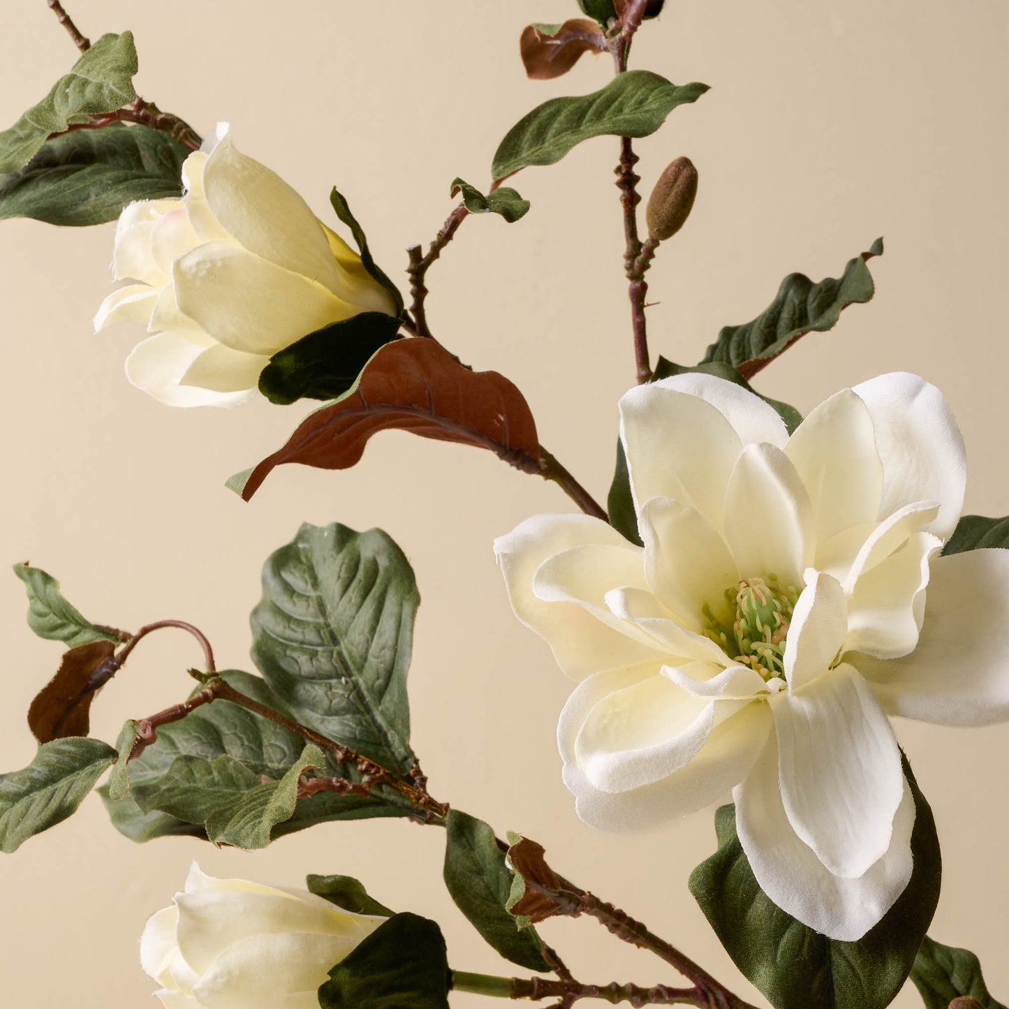 close up detail of faux magnolia floral stem