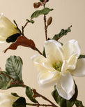 close up detail of faux magnolia floral stem