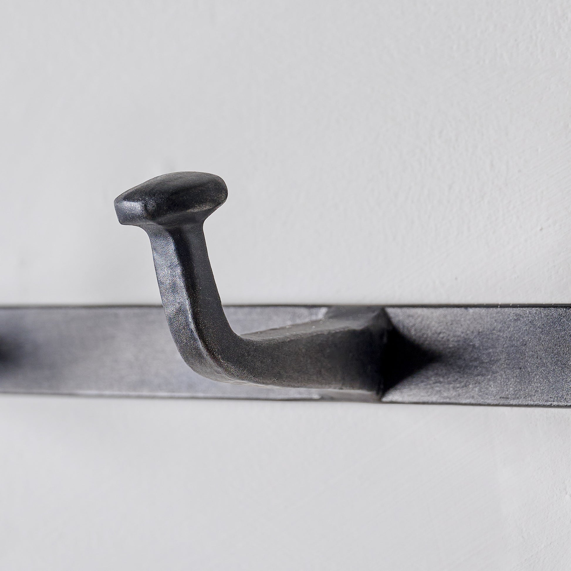 Hammered Aged Iron Wall Hooks up close