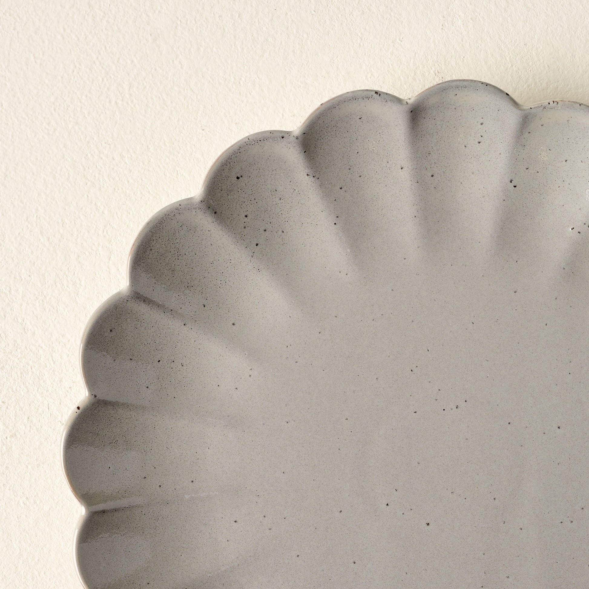 Grey Scalloped Plate close up