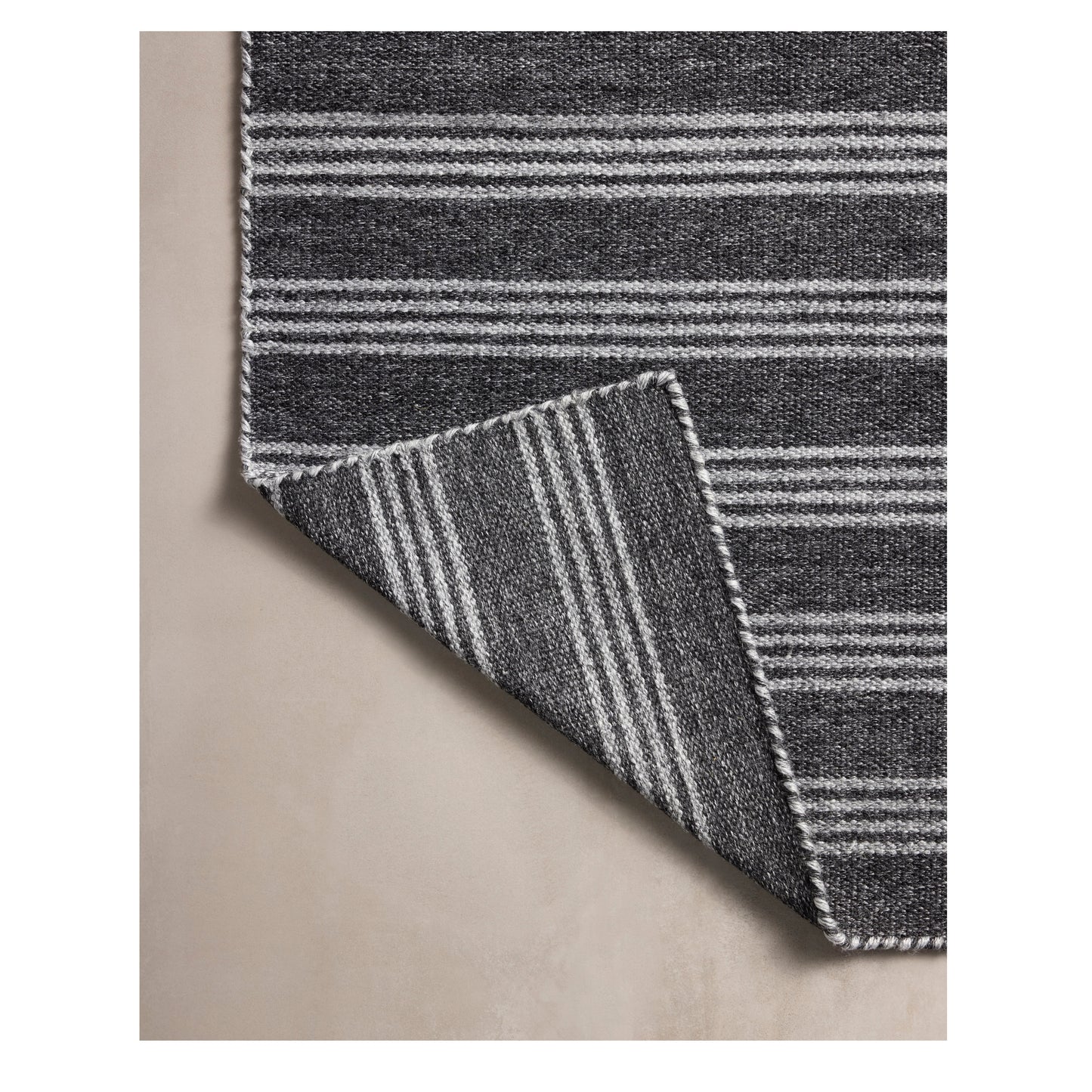 Charlie Charcoal Grey Rug corner folded back