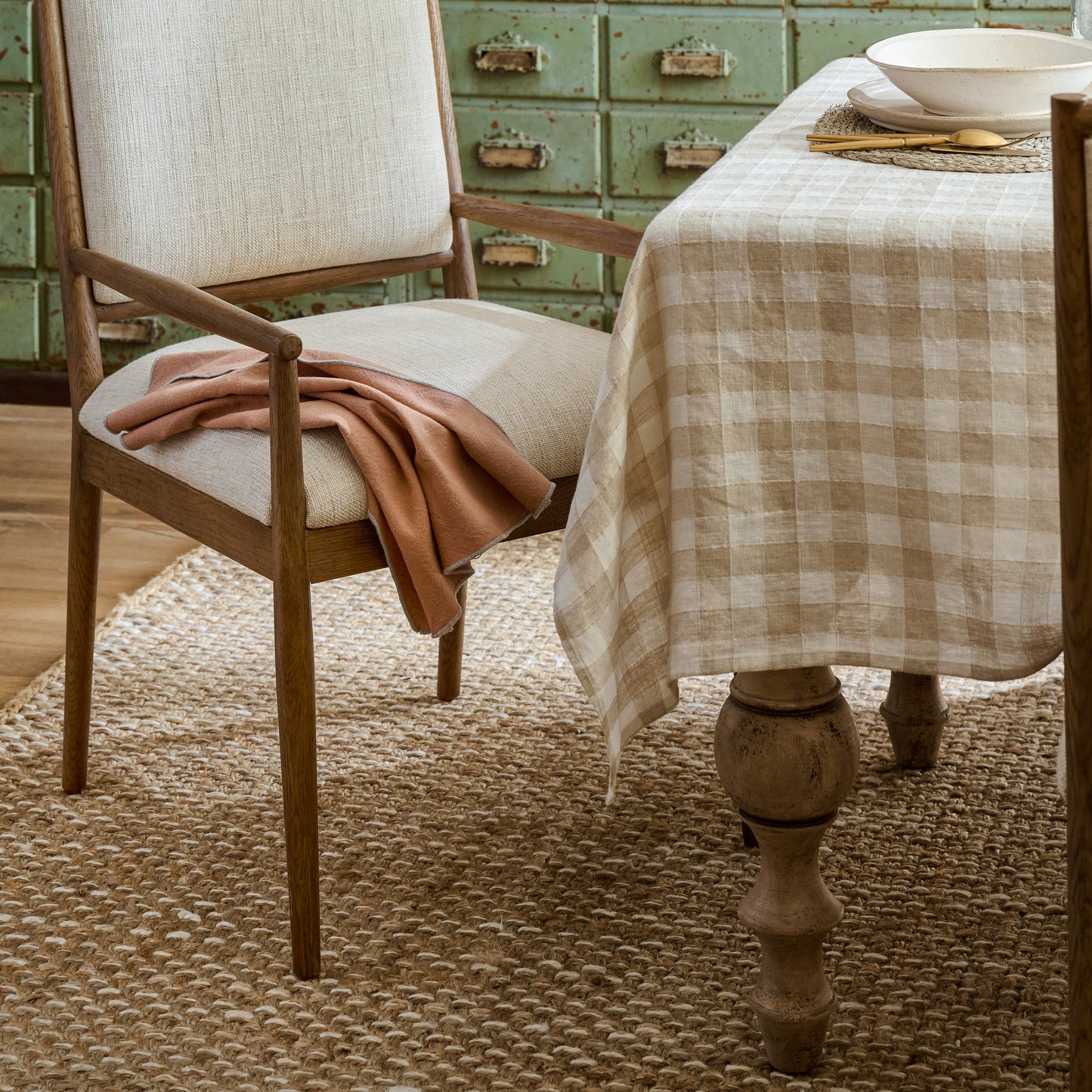 Cooper Natural Rug under a dining table and chair