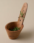 Wooden Herb Stemmer with herbs