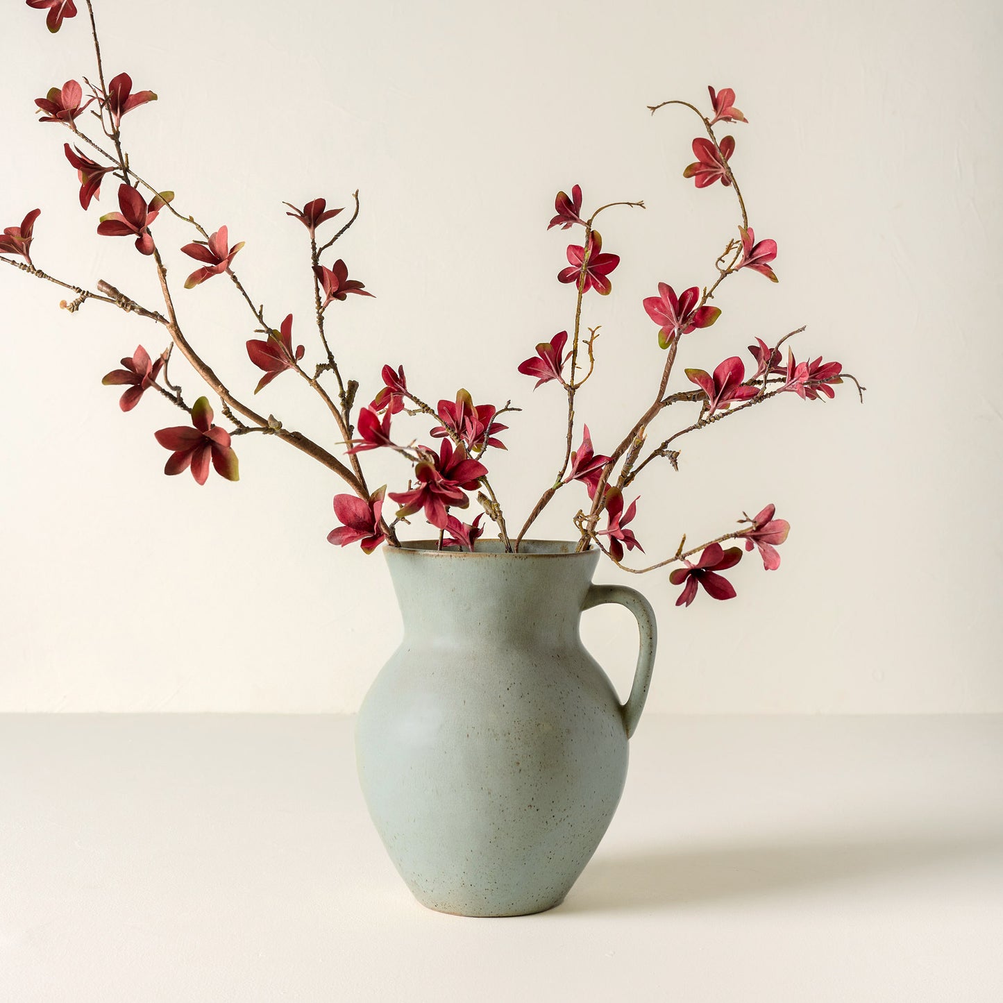 Large Rustic Green Vase holding flowers