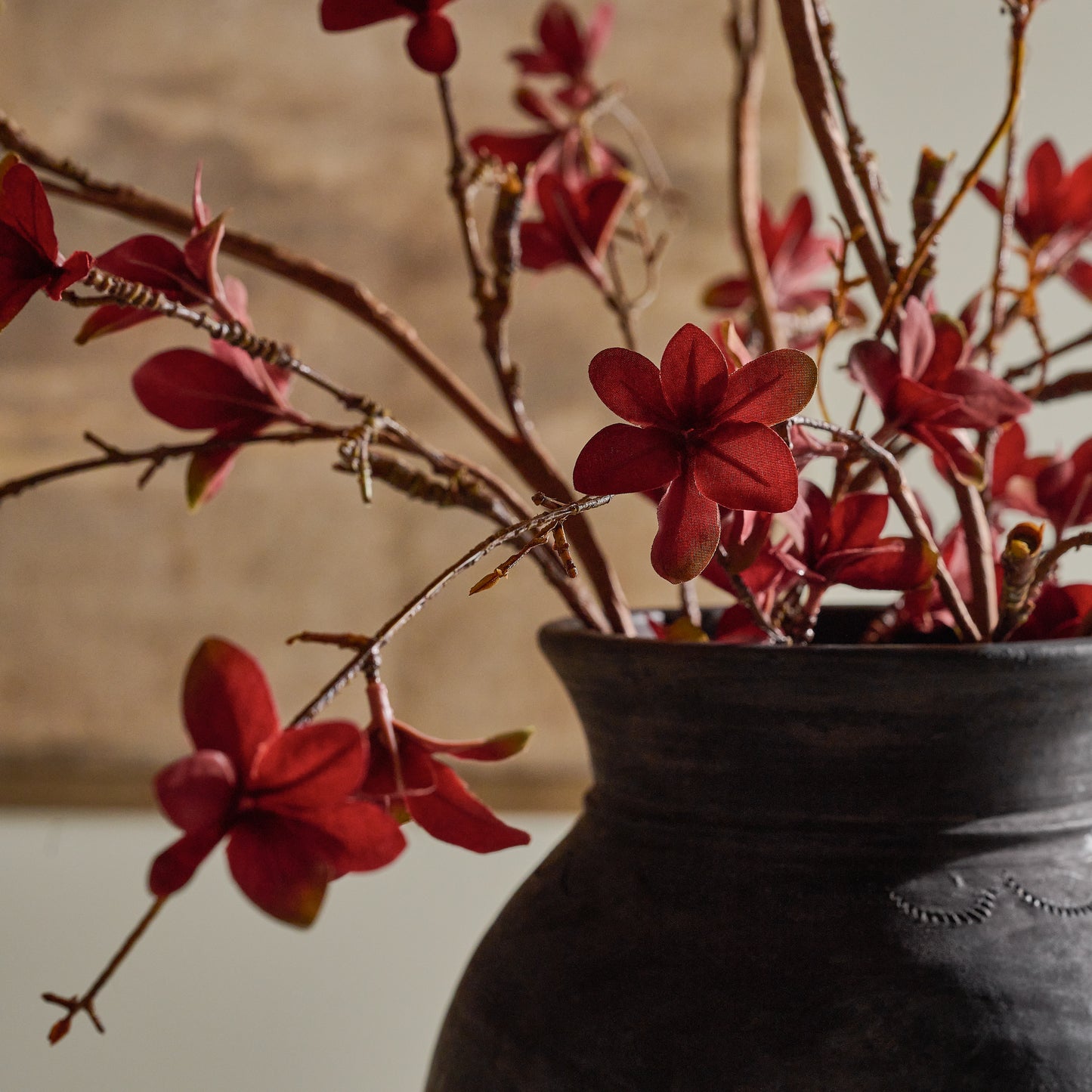 Large Magnolia Bloom Spray shown up close in dark vase