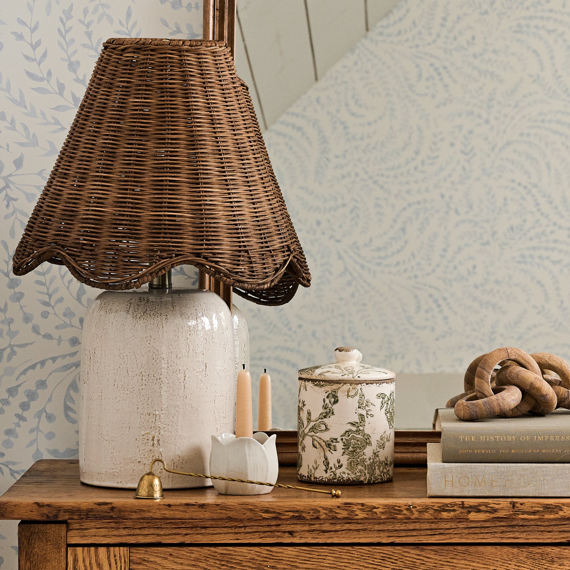 Small Green and White Distressed Canister on a dresser next to a table lamp