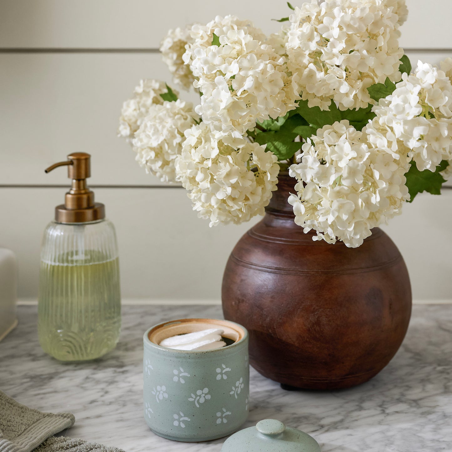 Snowball Hydrangea Bundle shown on bathroom counter in vase