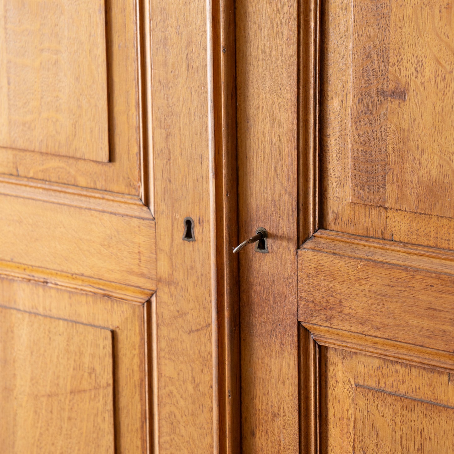 key and lock detail on antique armoire doors