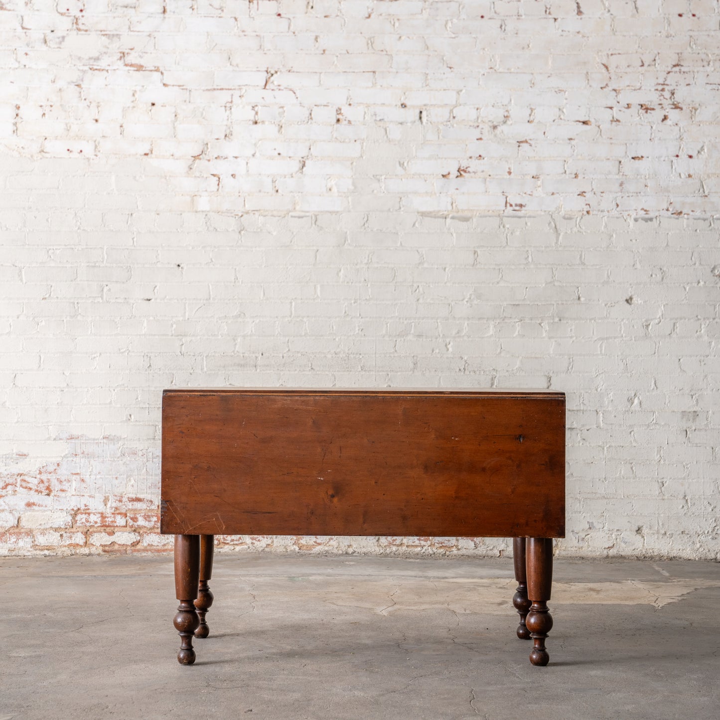 Antique Primitive Drop Leaf Table Circa 1830 shown from side with leaf down