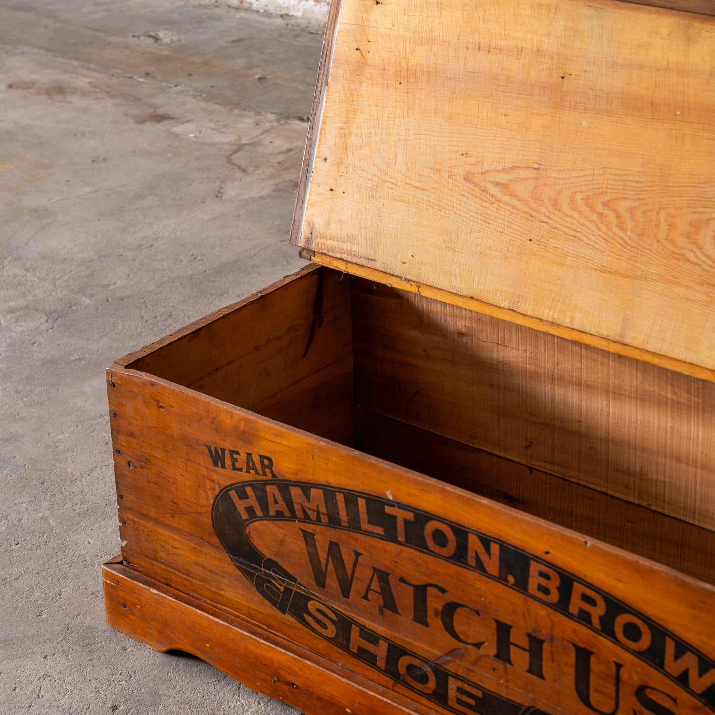 Antique Hamilton Brown Shoe Co. Wooden Trunk shown up close with top open
