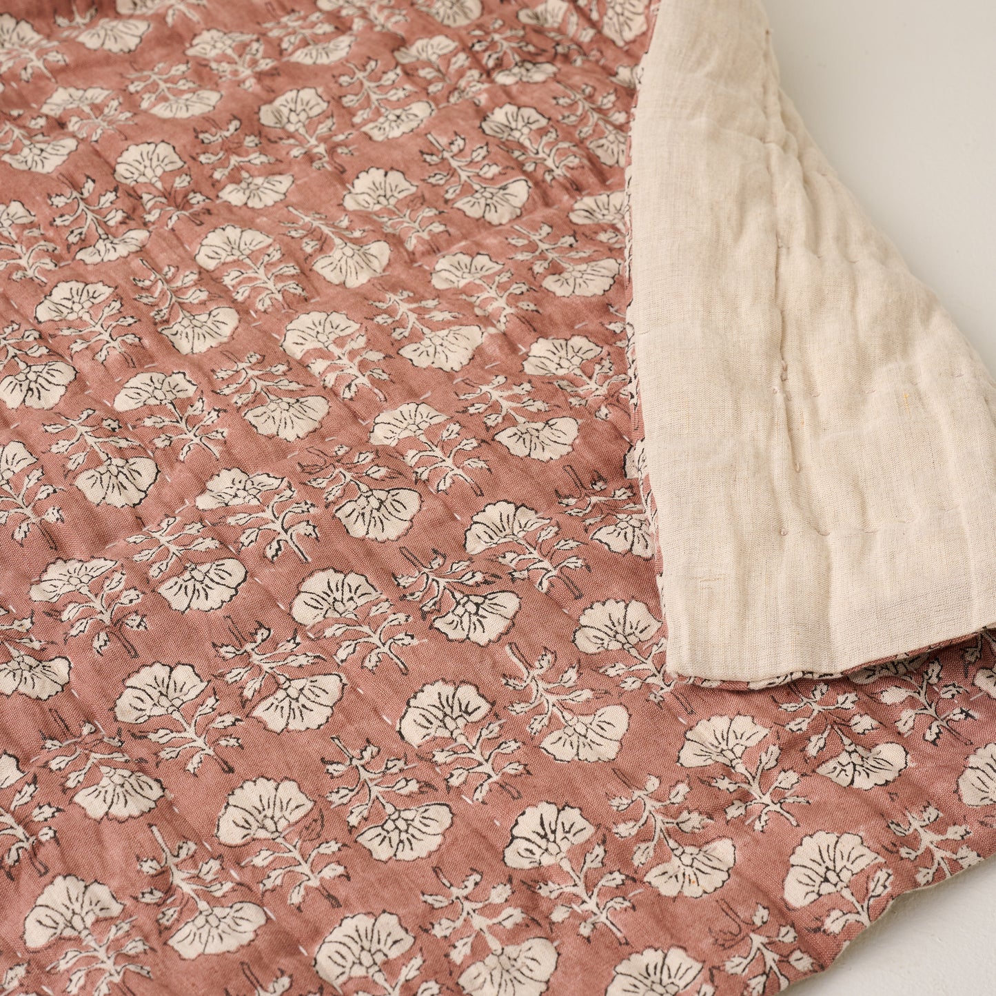 Top view of Flora Block Desert Clay Print Quilt