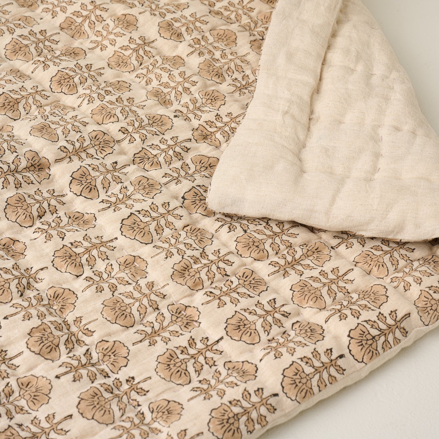 Top view of Flora Block Natural Print Quilt