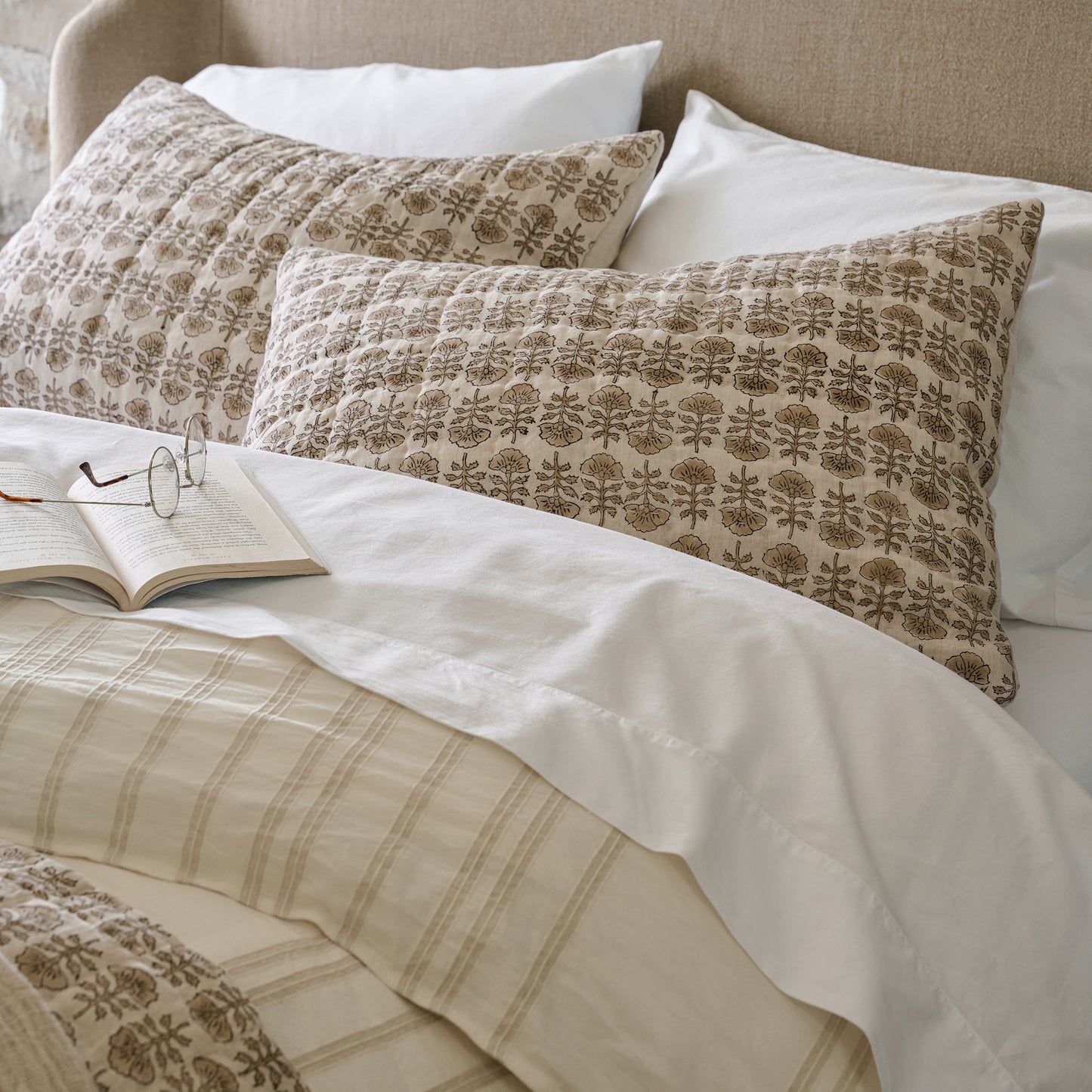 Made bed with two Flora Block Natural Print Pillow Shams