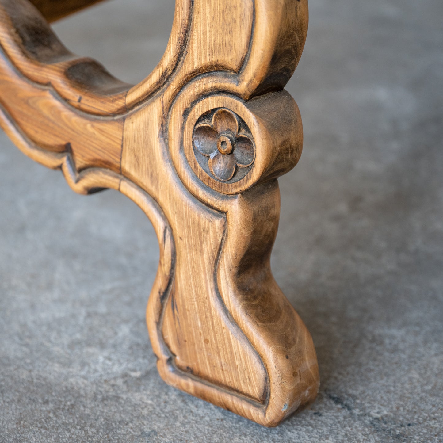 Antique Solid Oak Spanish Colonial Table close up of wood carved flower on table leg