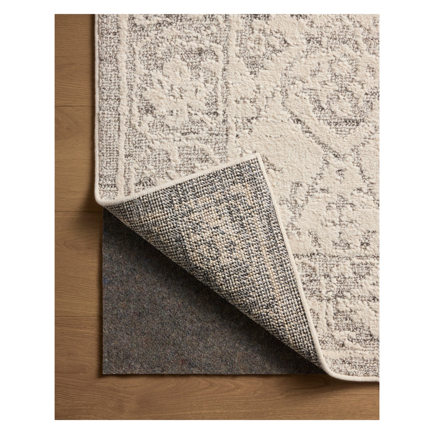 Gigi Ivory Stone Rug corner flipped back