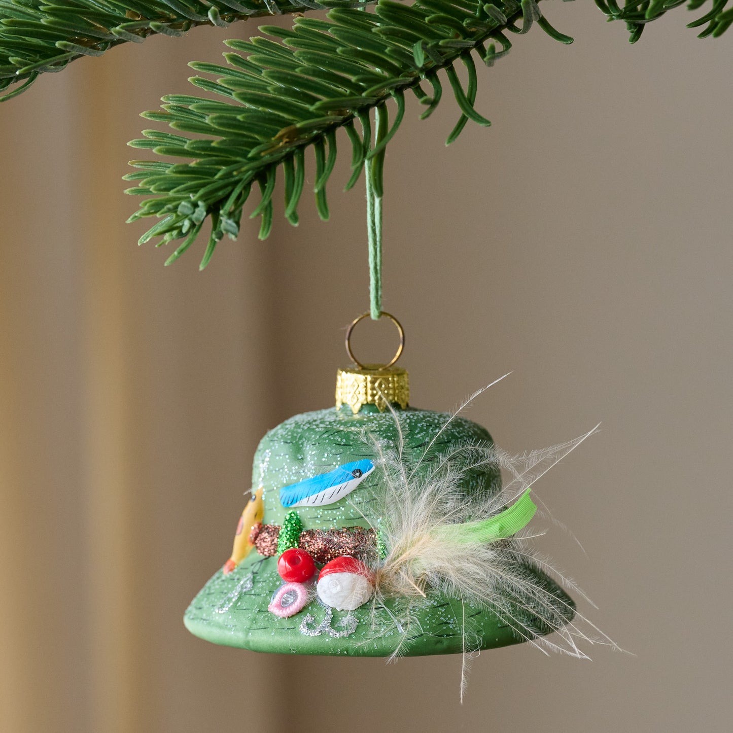 Gone Fishin' Bucket Hat Ornament shown hung on tree