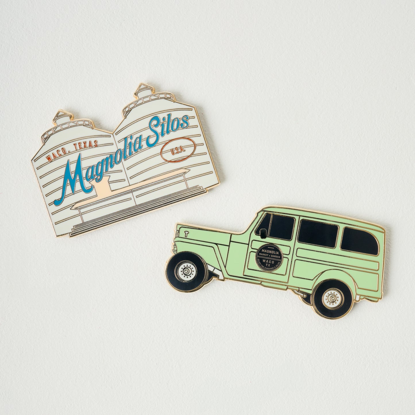 Magnolia Silos Colored Enamel Magnet shown with jeep magnet