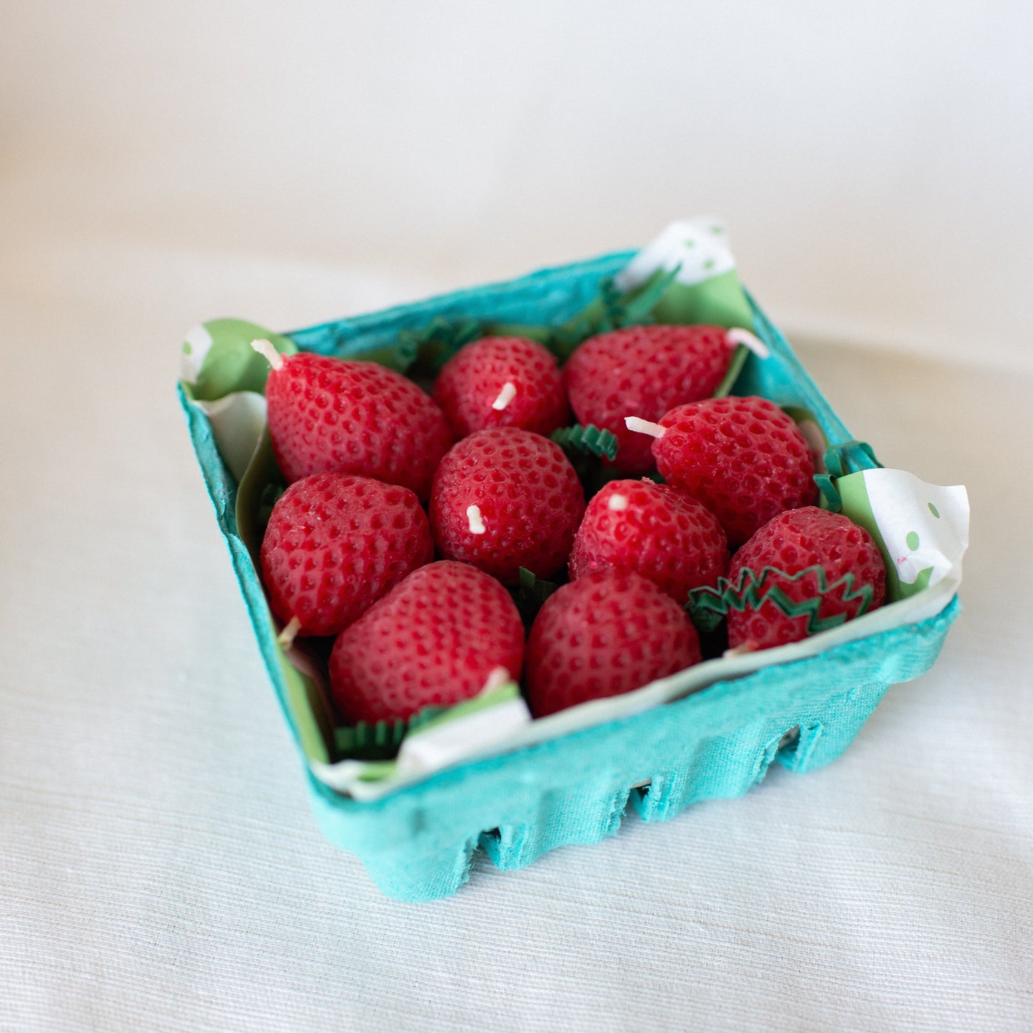 Strawberry Birthday Candle Set of 10 shown in carton