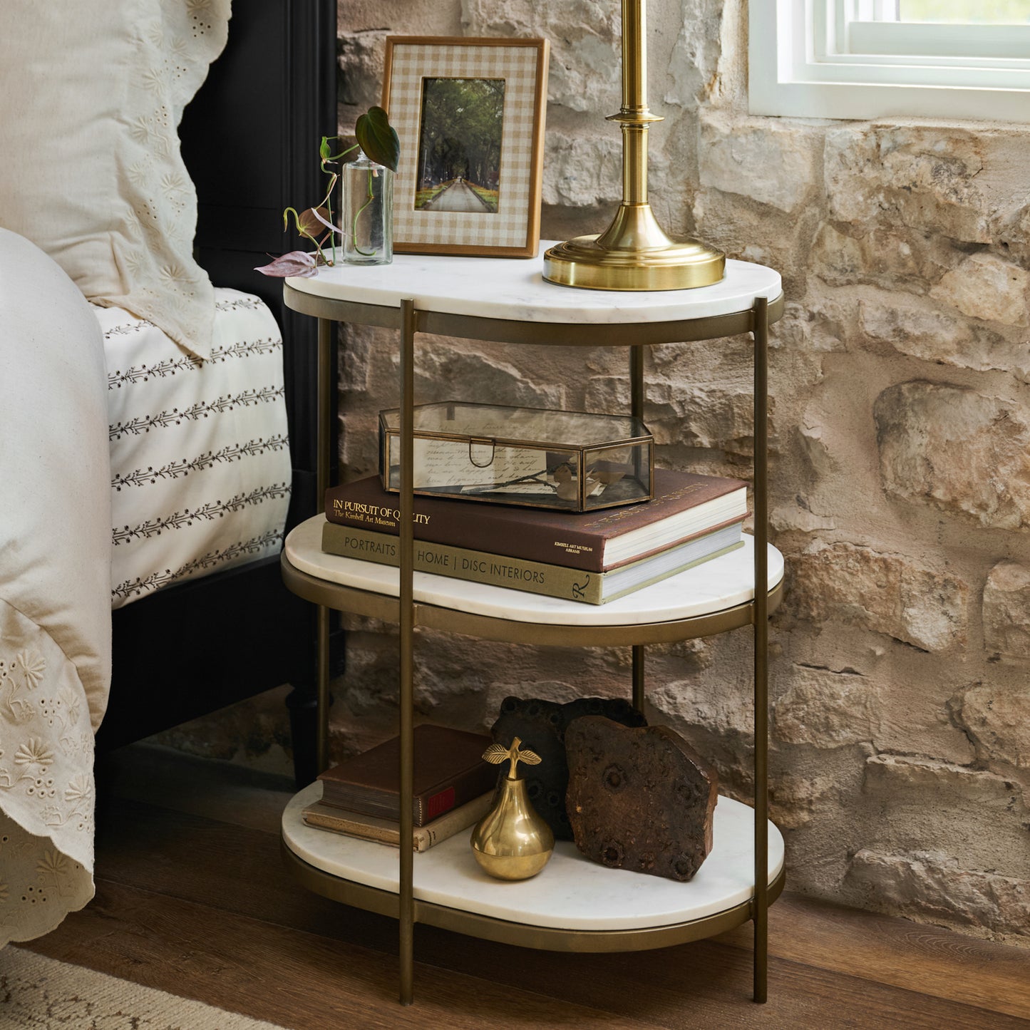 Solid Brass Pear Trinket Box on a nightstand