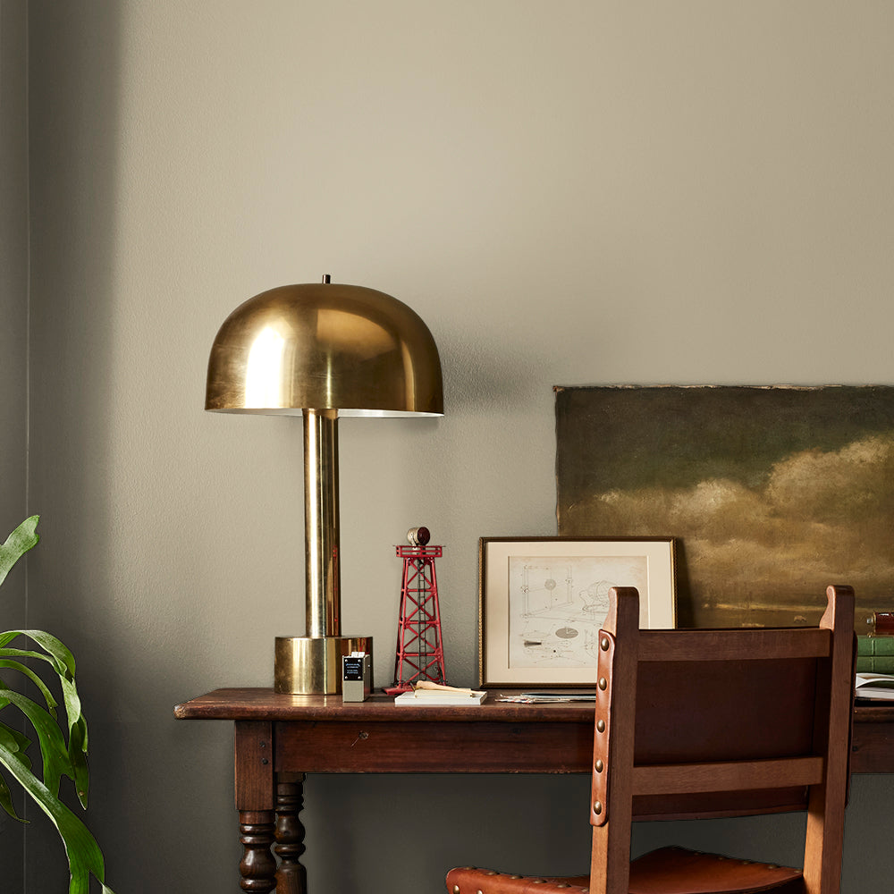 sunwashed green paint color named juniper tree shown painted on bedroom wall