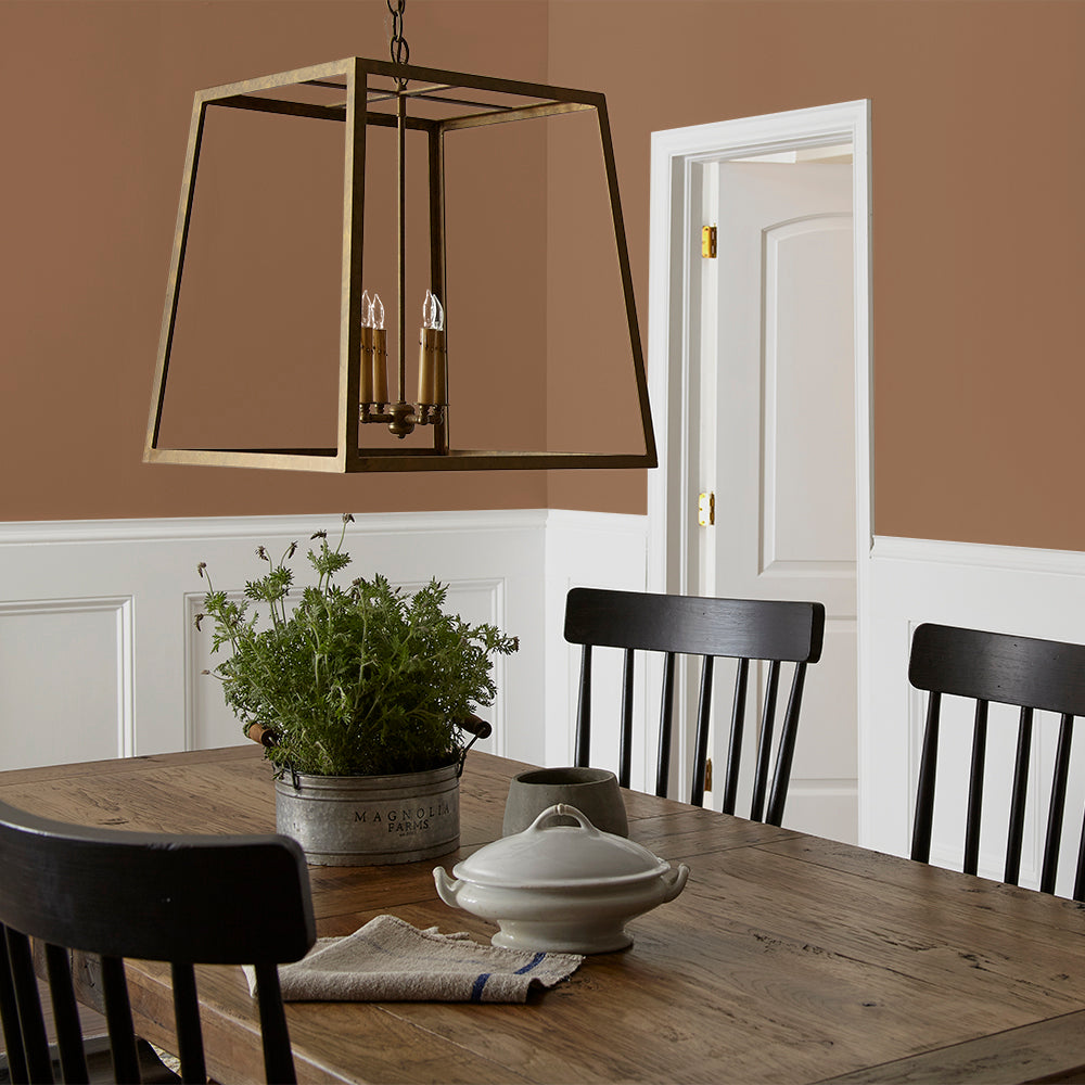 earthy brown with reddish hue paint color named cognac shown painted on dining room wall