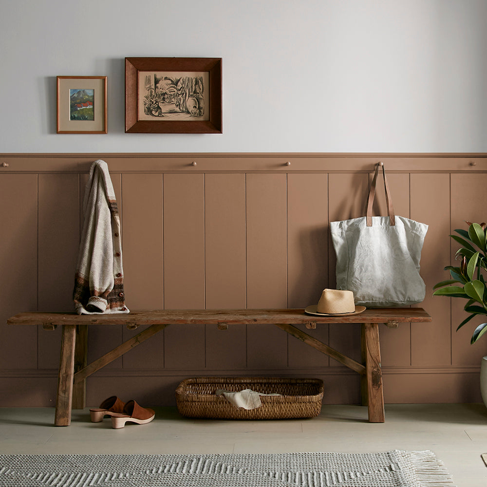 earthy brown with reddish hue paint color named cognac shown painted on entryway wall