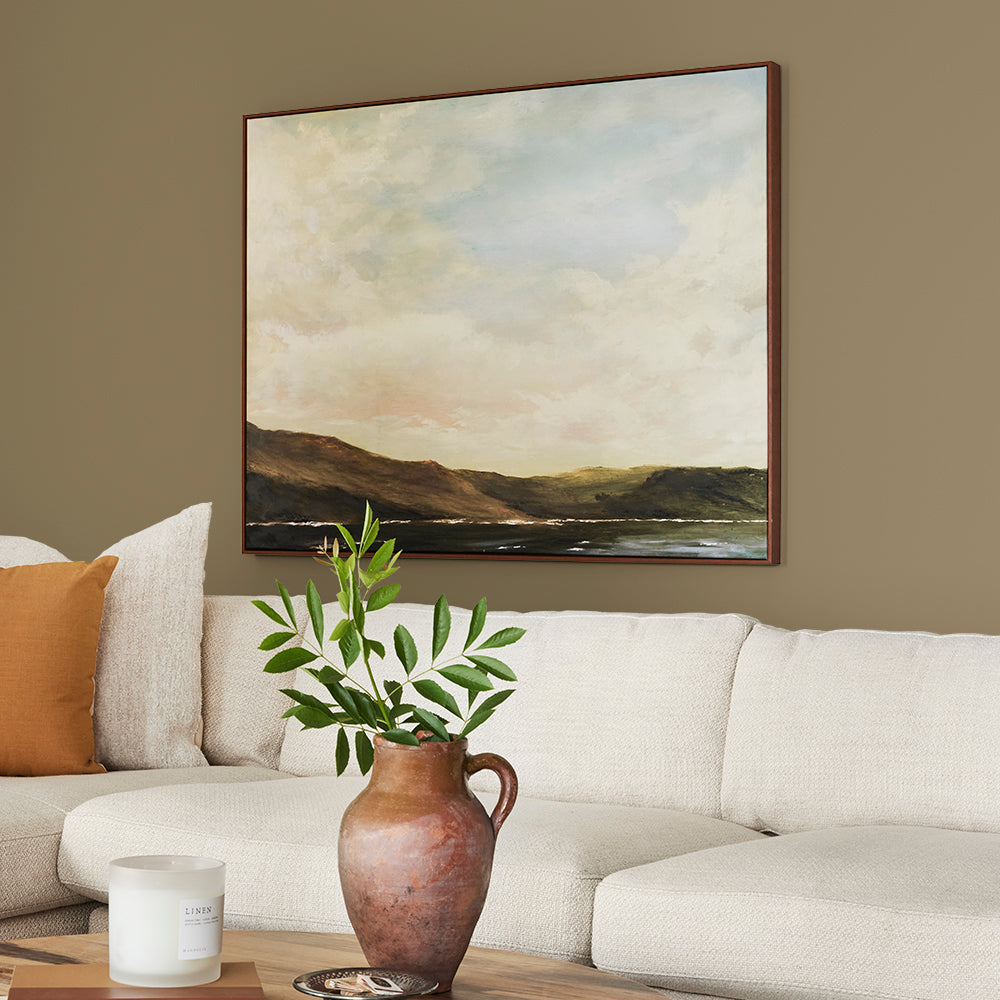 rich green with brown undertone paint color named remote trail shown painted on living room wall